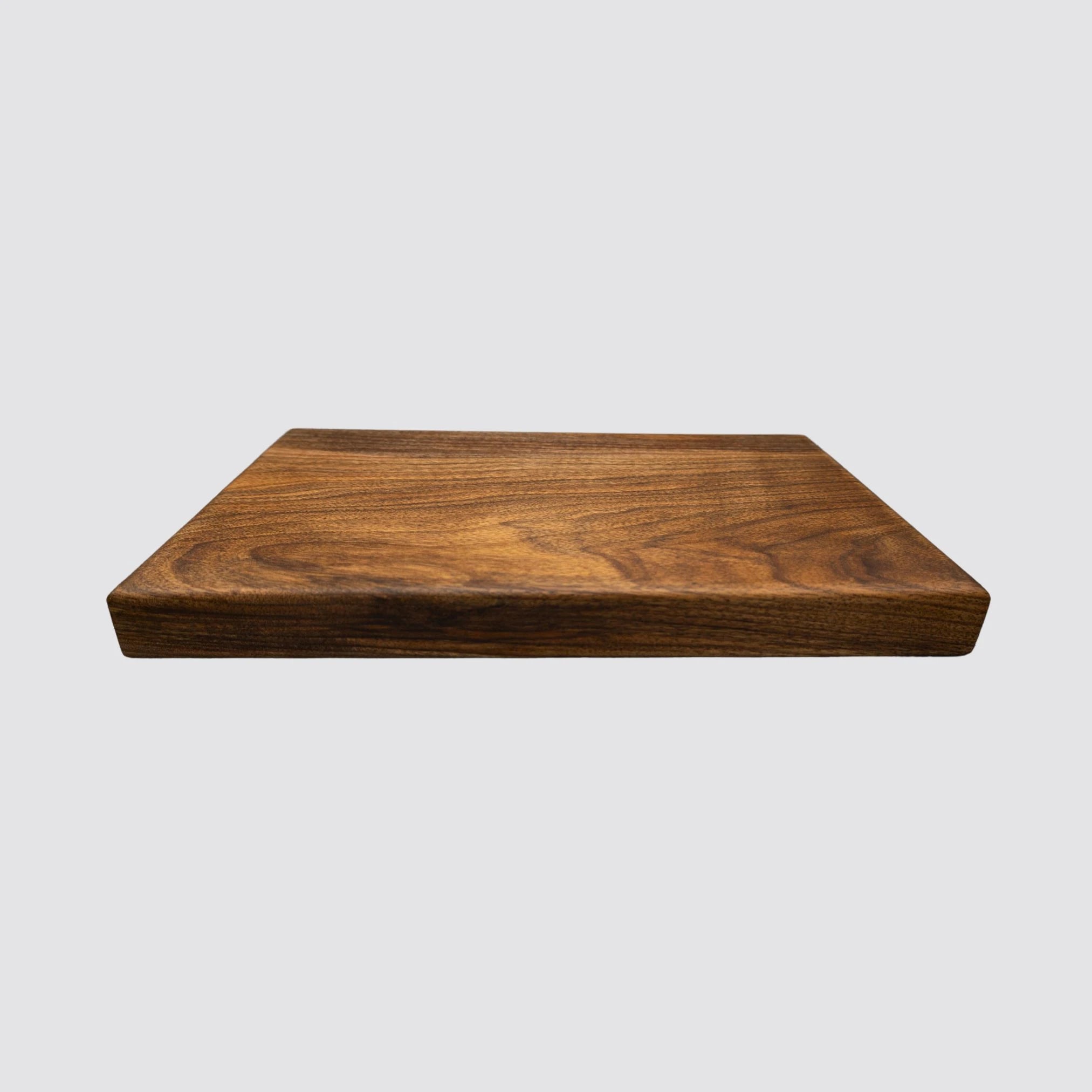 Luxury walnut chopping board with a smooth, knife-friendly surface and thick size.