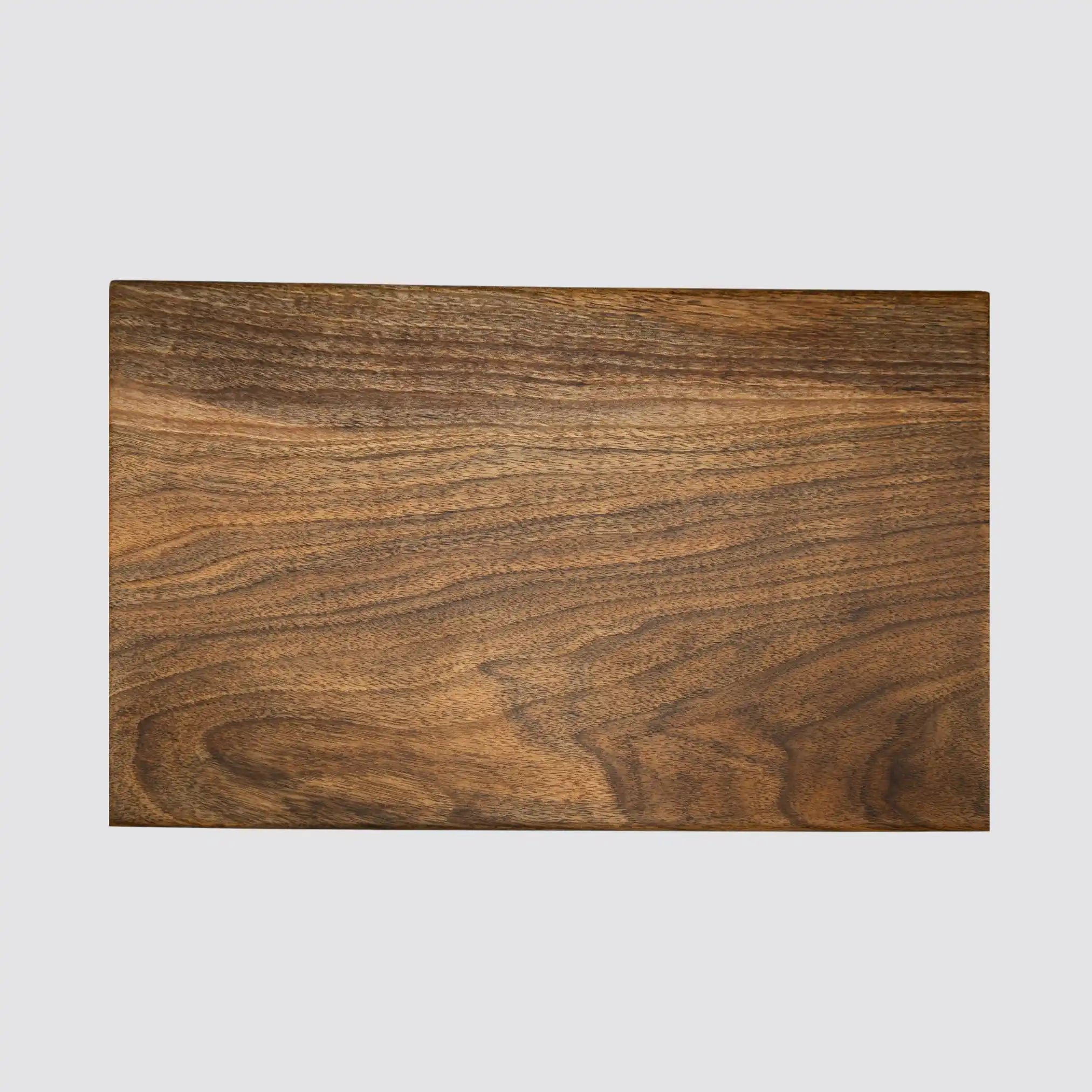 A walnut chopping board highlighting its natural wood grain and its luxurious style.