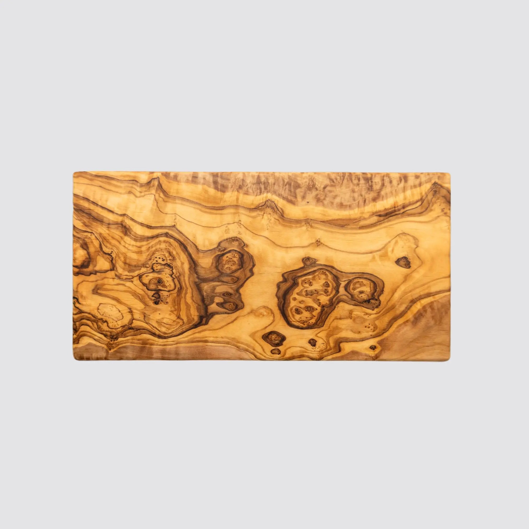 Artisan rectangle olive wood board showcasing intricate grain details.