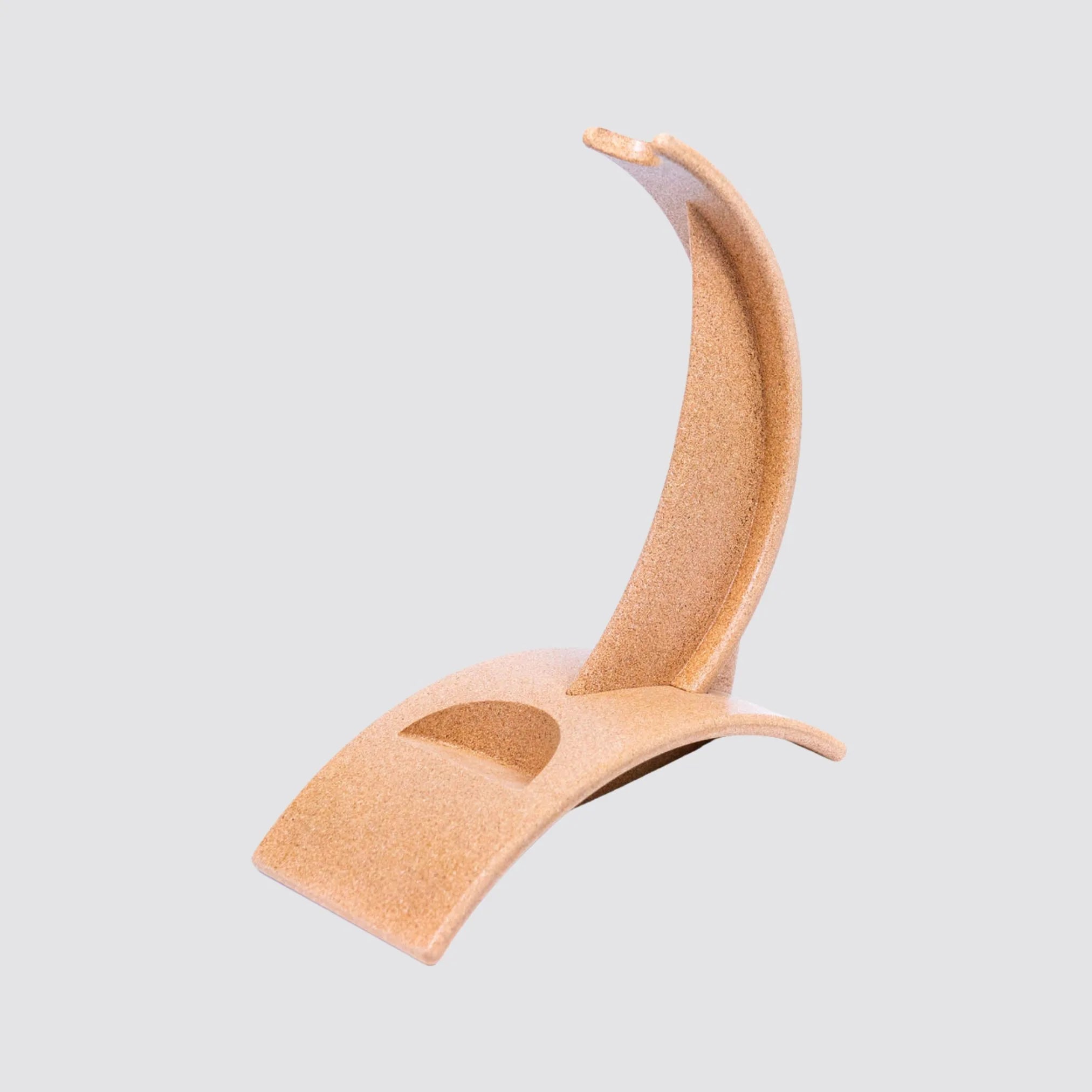 Artistic cork wine holder with wave structure for countertop display.