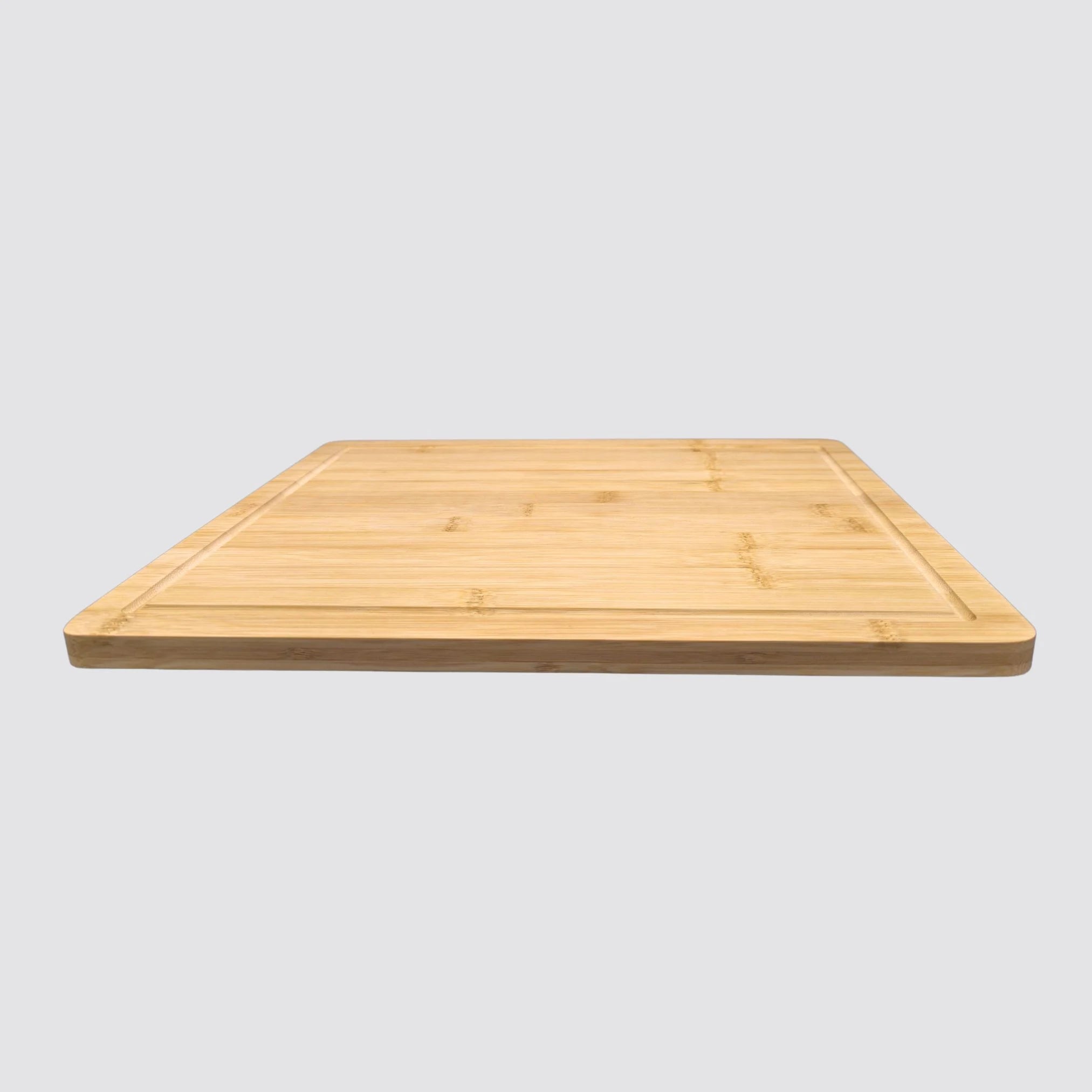 Bamboo cutting board highlighting natural grain patterns and polished surface.