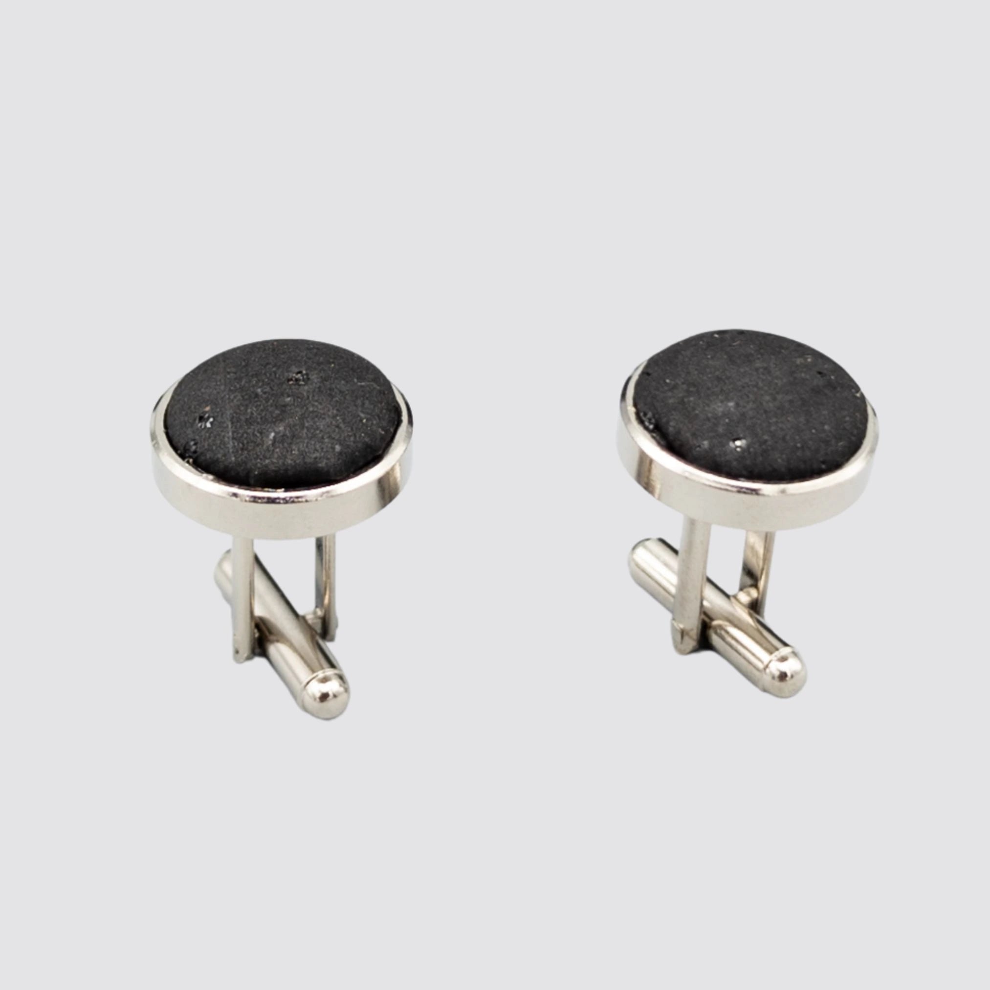 Side close-up view of the Black Cork Cufflink Set on a plain background.