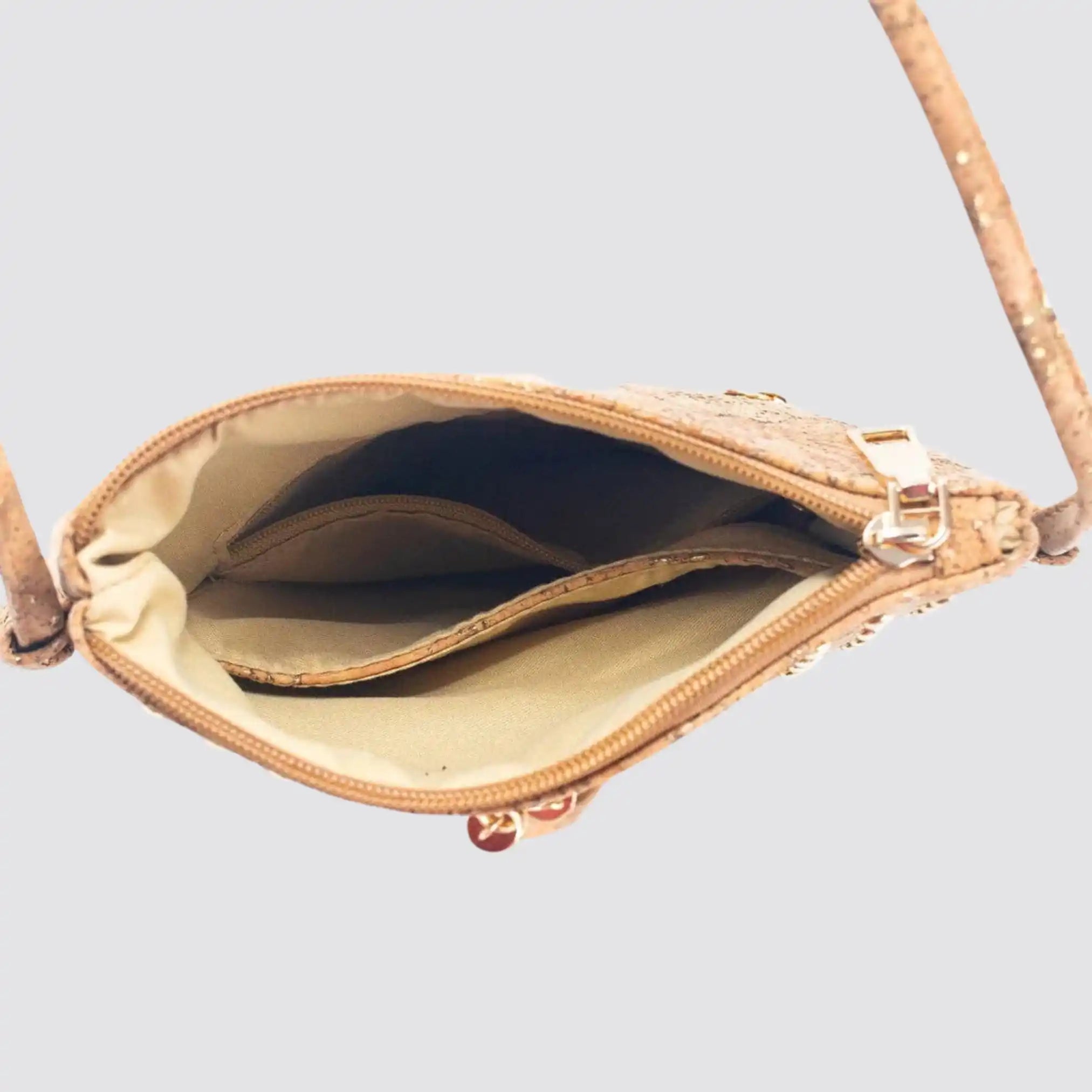 Compact cork crossbody bag designed for organized everyday storage.