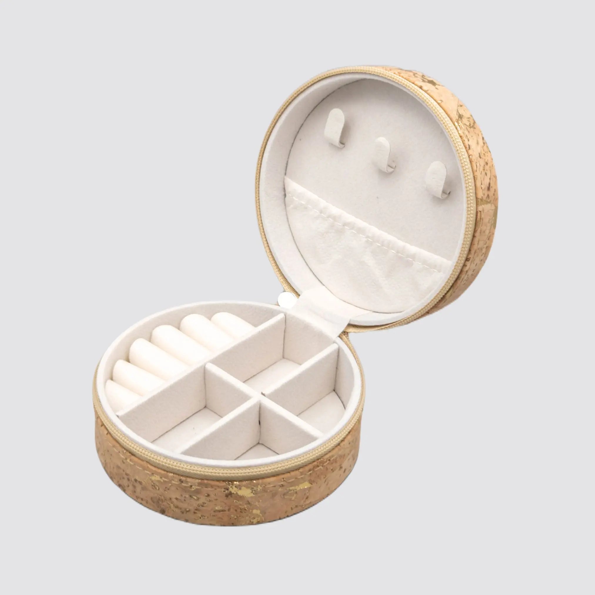 Compact cork jewellery box for travel and home accessory storage.