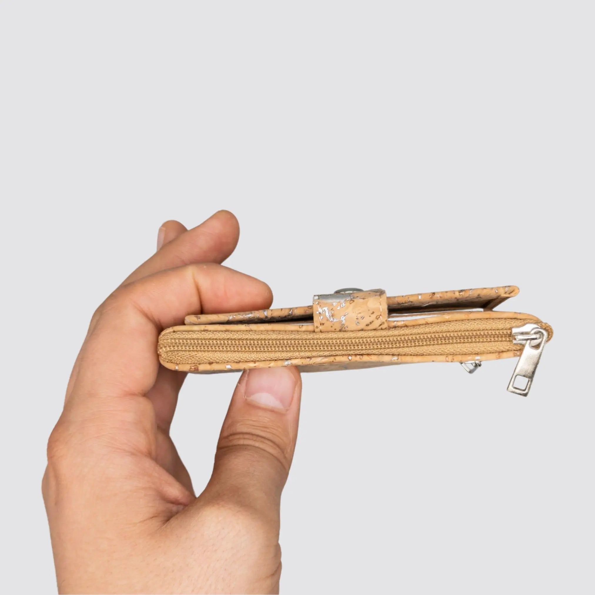 Compact eco-friendly cork wallet featuring a silver finish and smart organization.