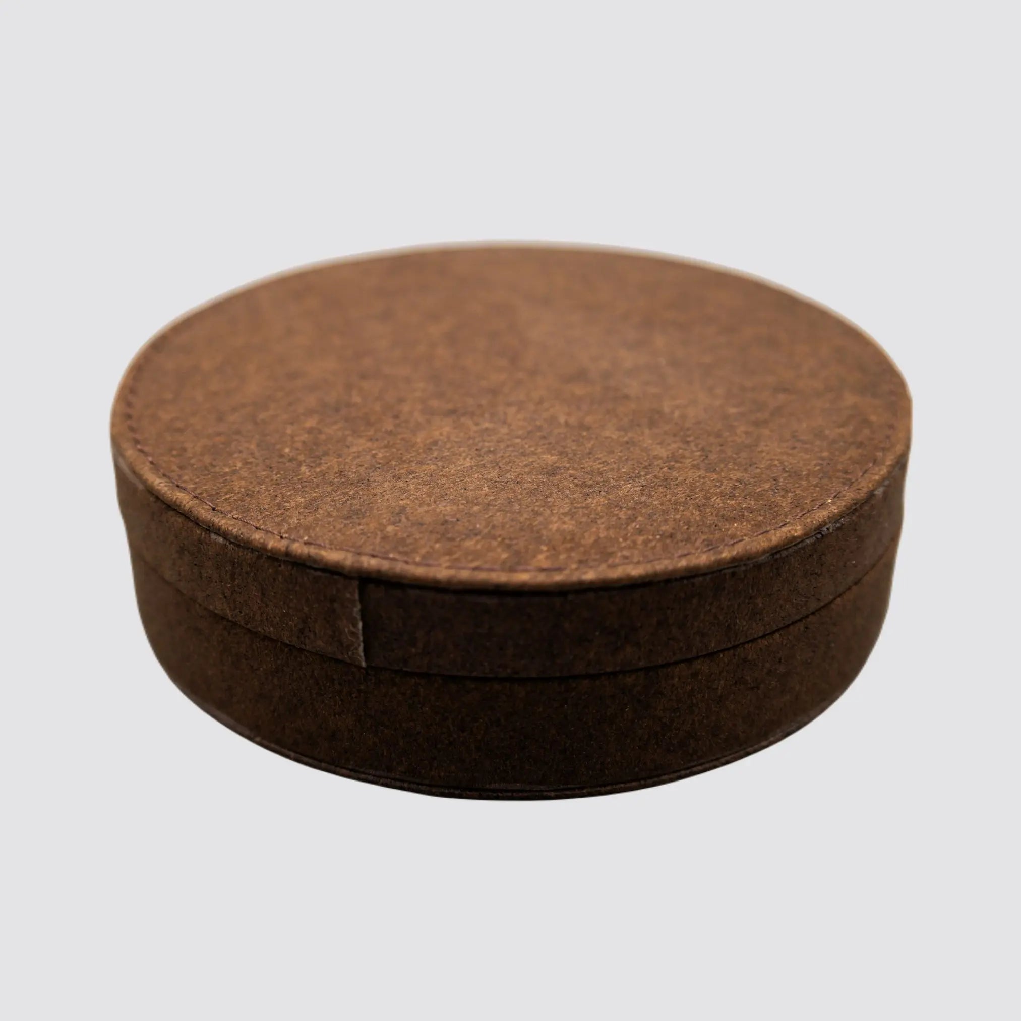 Front view of the Cork Box Wine Accessory Set with a sleek natural cork finish, showcasing its compact and stylish design on a plain background.
