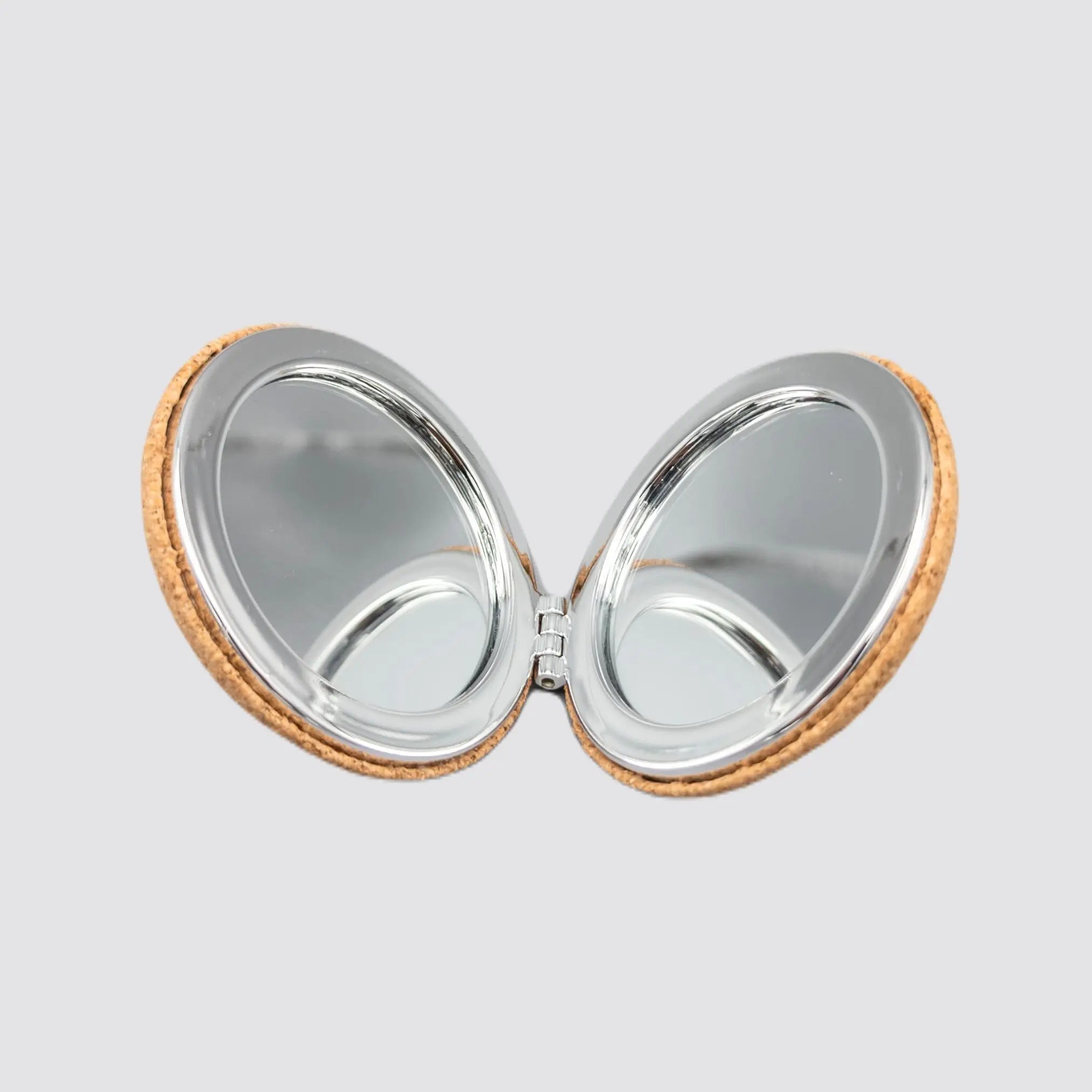 Open view of the dual magnification cork makeup mirror, displaying both mirrors.