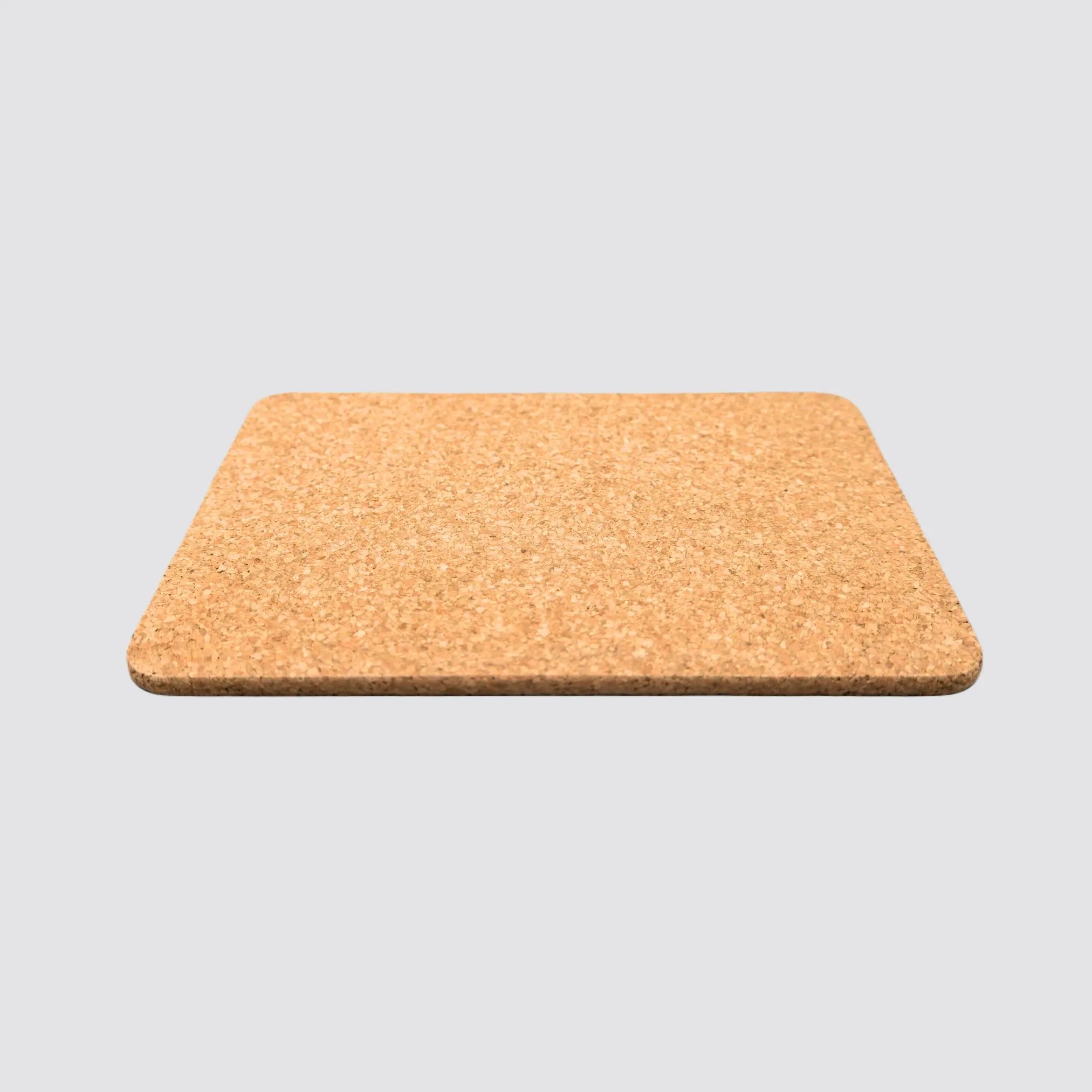 Heat-resistant cork placemat in a sleek rectangular design.