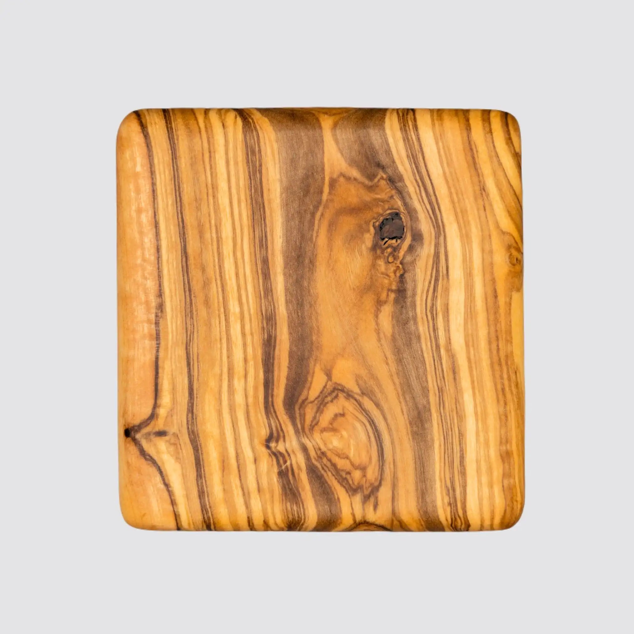 Durable olive wood coaster designed to shield tables from spills and stains.