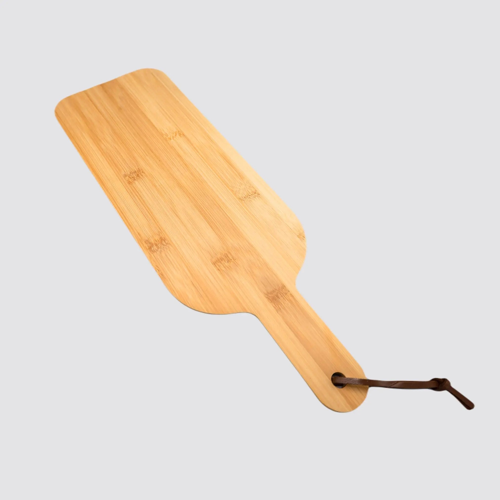 Eco-friendly bamboo board with an ergonomic handle for comfortable grip.