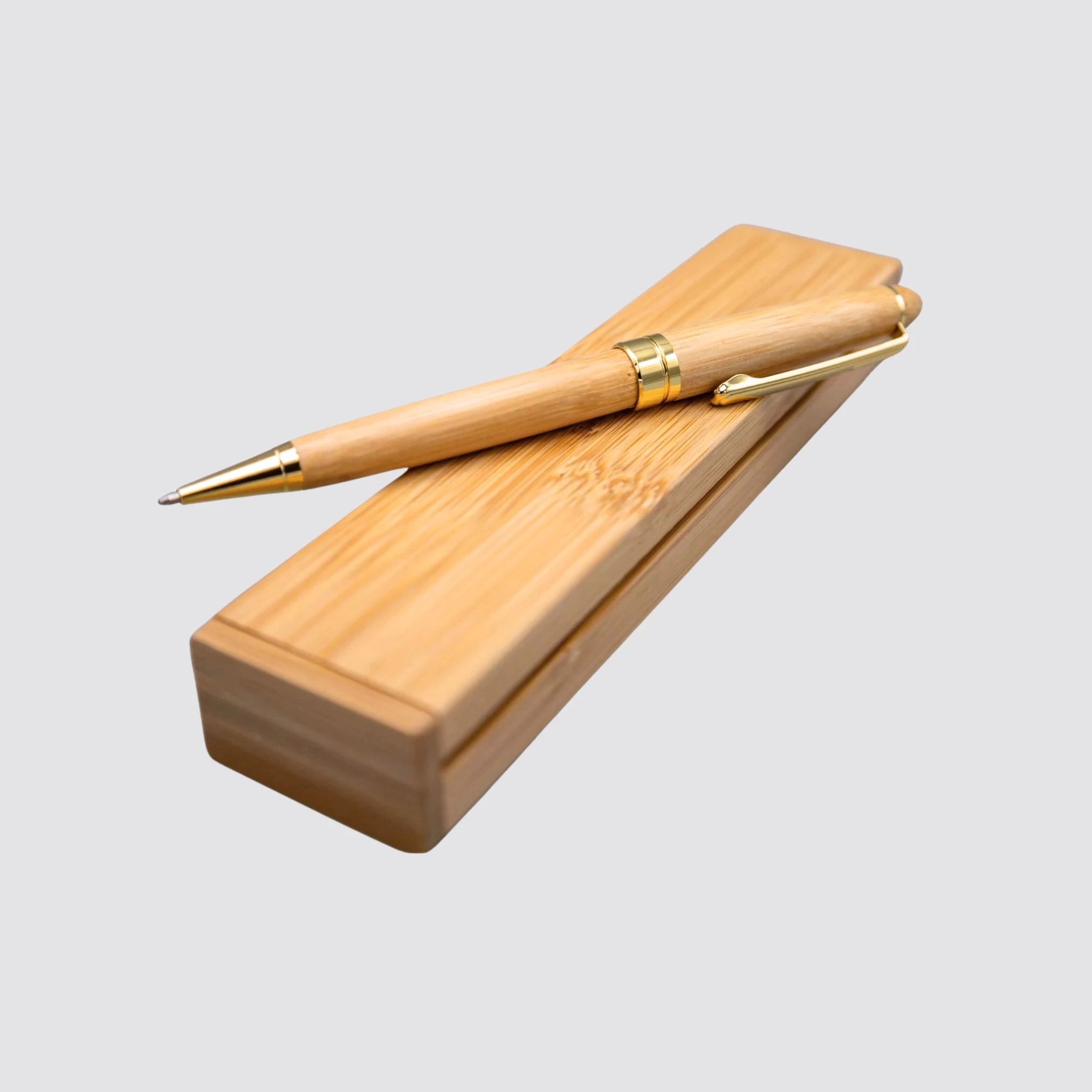 Eco-friendly bamboo pen set presented on a light gray background.