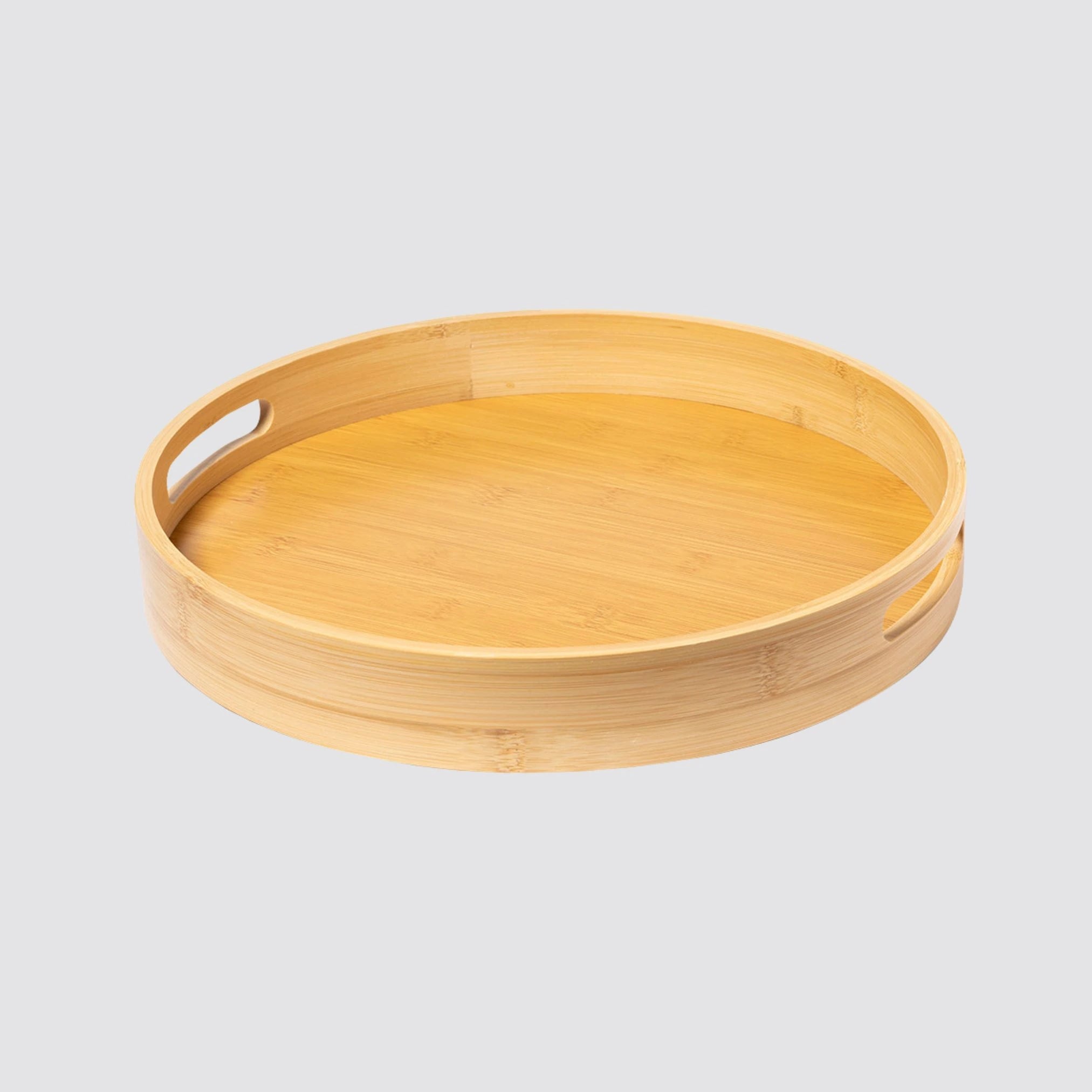 Eco-friendly bamboo serving tray with cut-out handles for easy carrying.