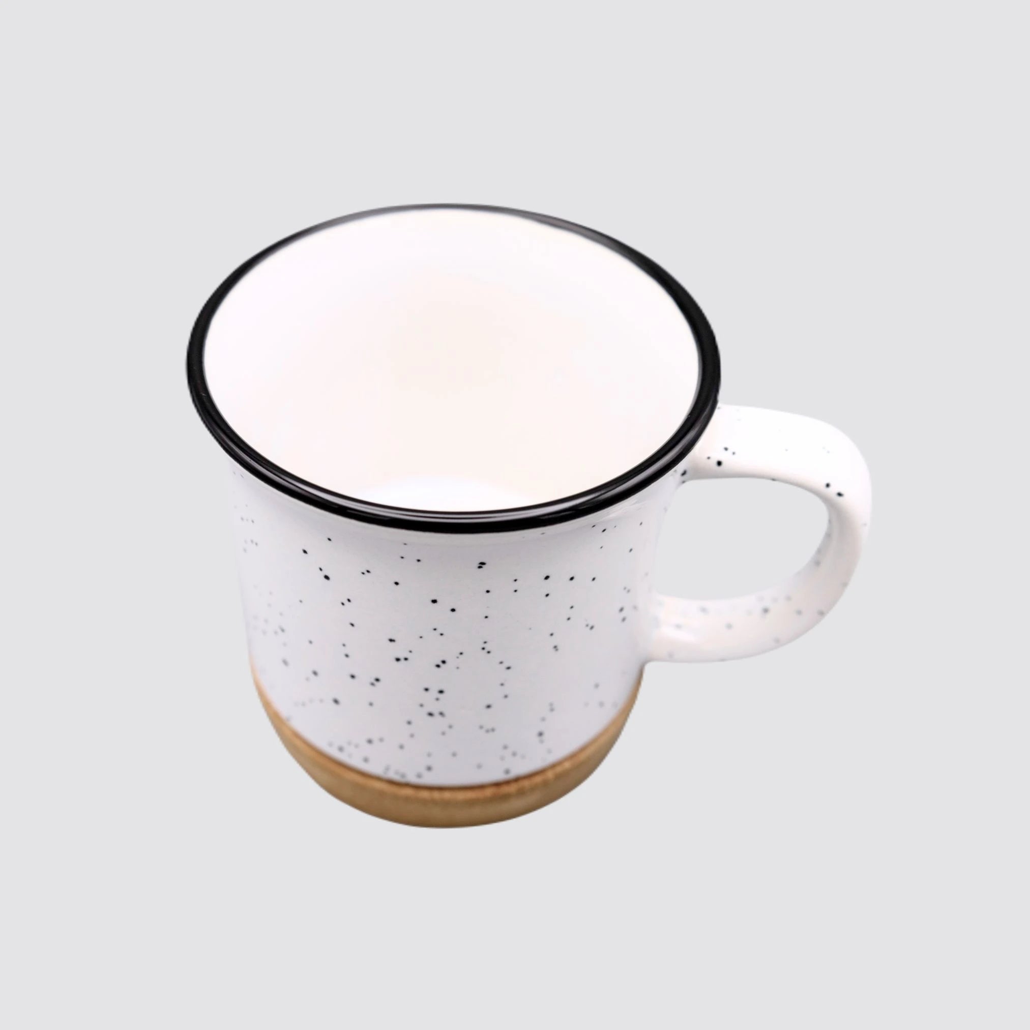 Eco-friendly ceramic mug featuring a black rim and bamboo base.