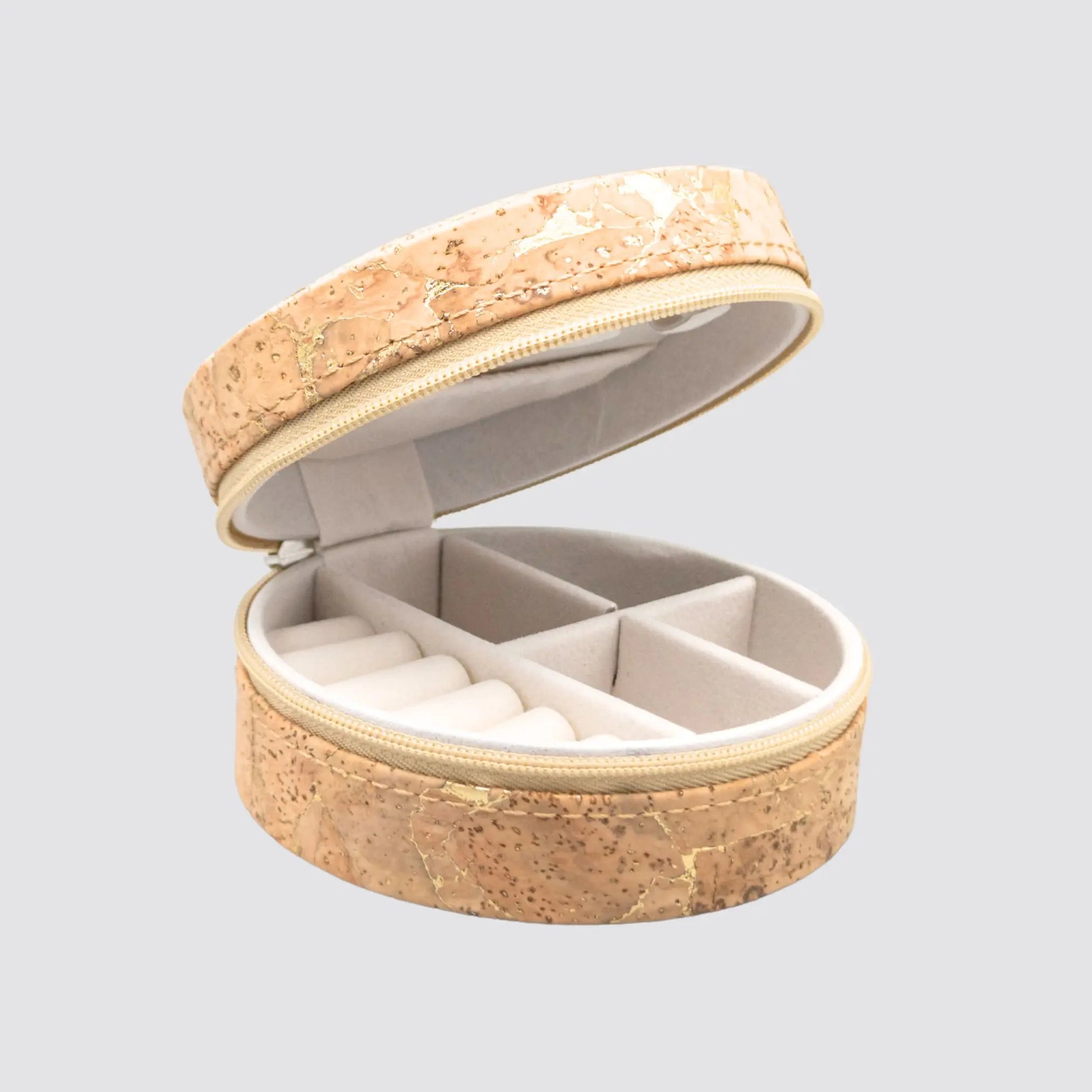 Eco-friendly cork jewellery box with gold accents and a secure zip closure.