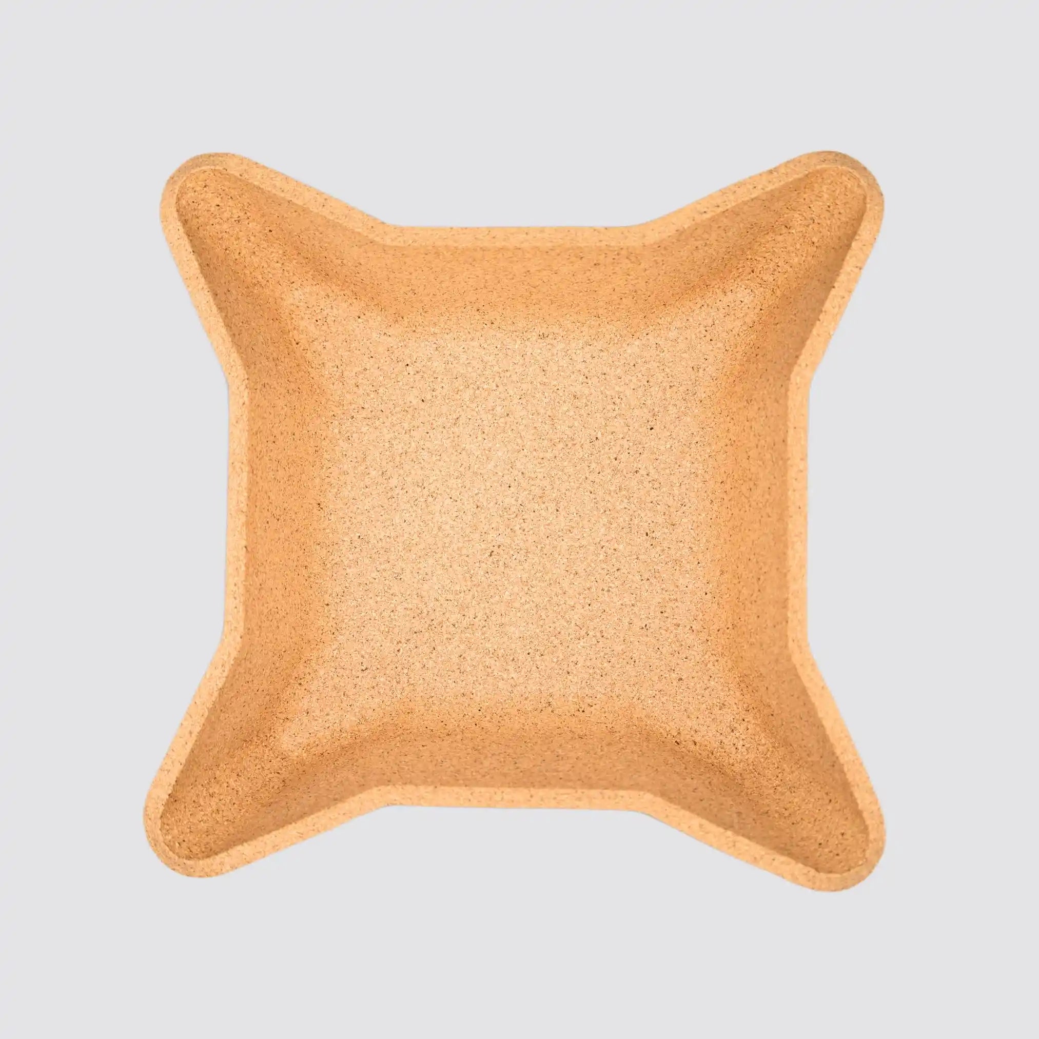 Eco-friendly cork valet tray featuring unique star-shaped contours.