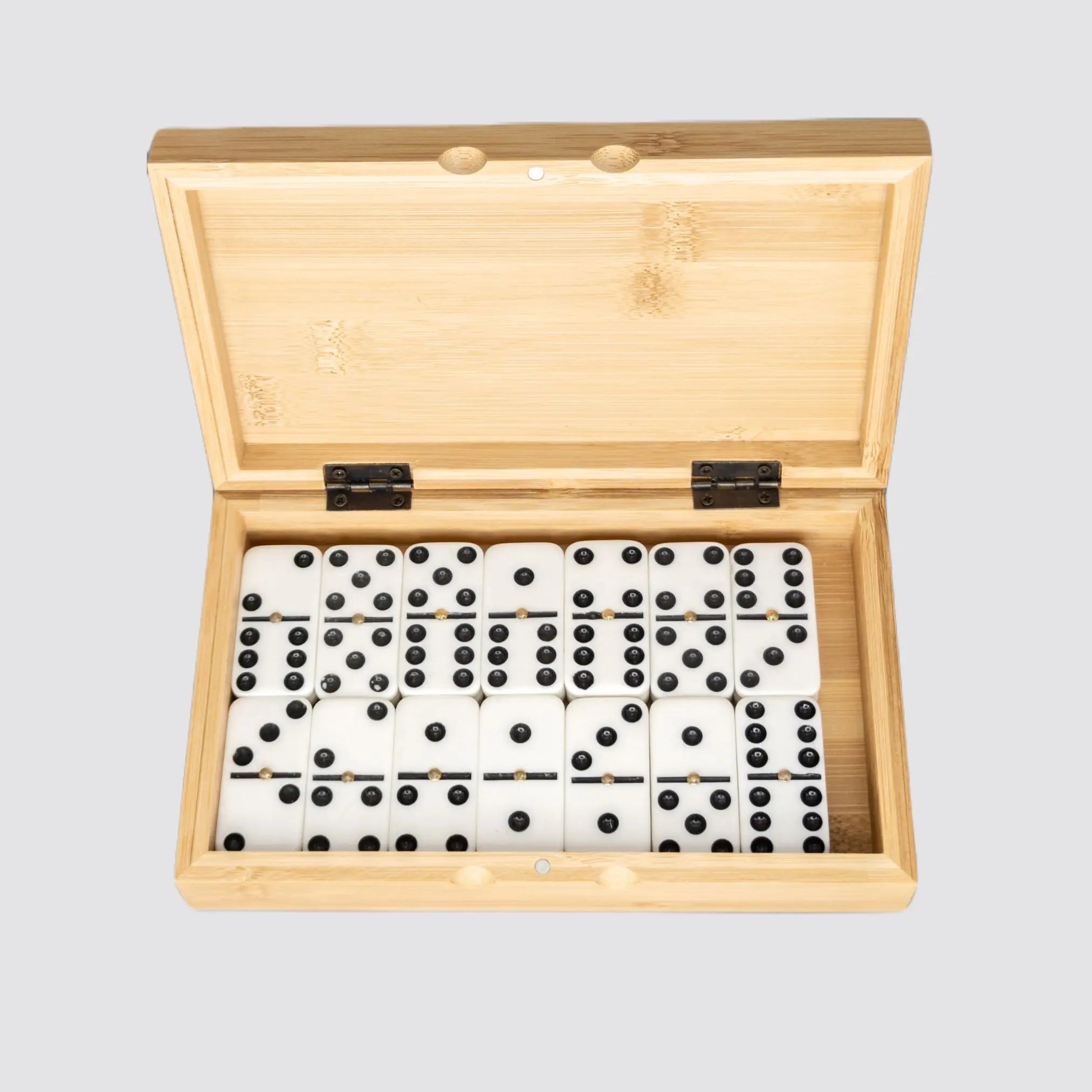 Eco-friendly dominoes set displayed with an open bamboo case, showcasing the 28 tiles.