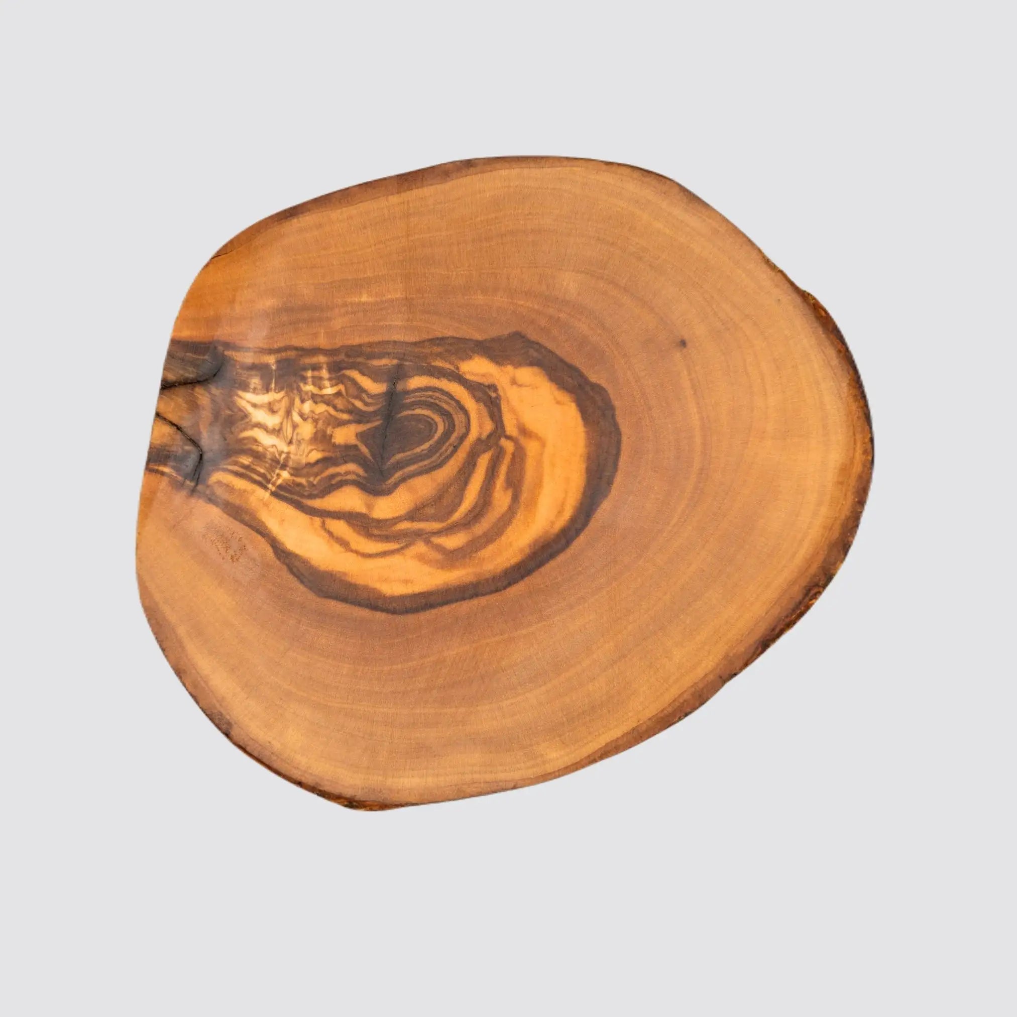 Olive wood coaster for glasses, mugs, and small bowls.
