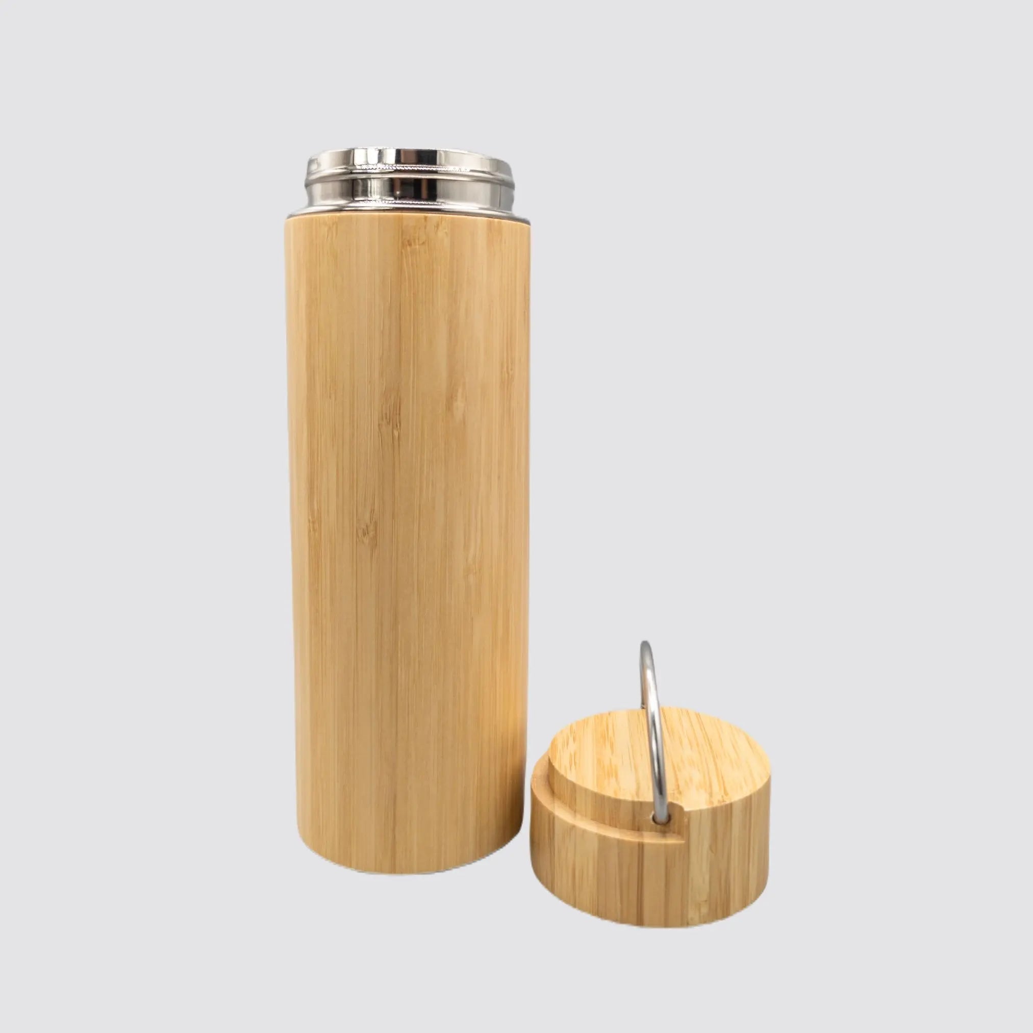Elegant bamboo thermos with stainless steel interior for temperature retention.