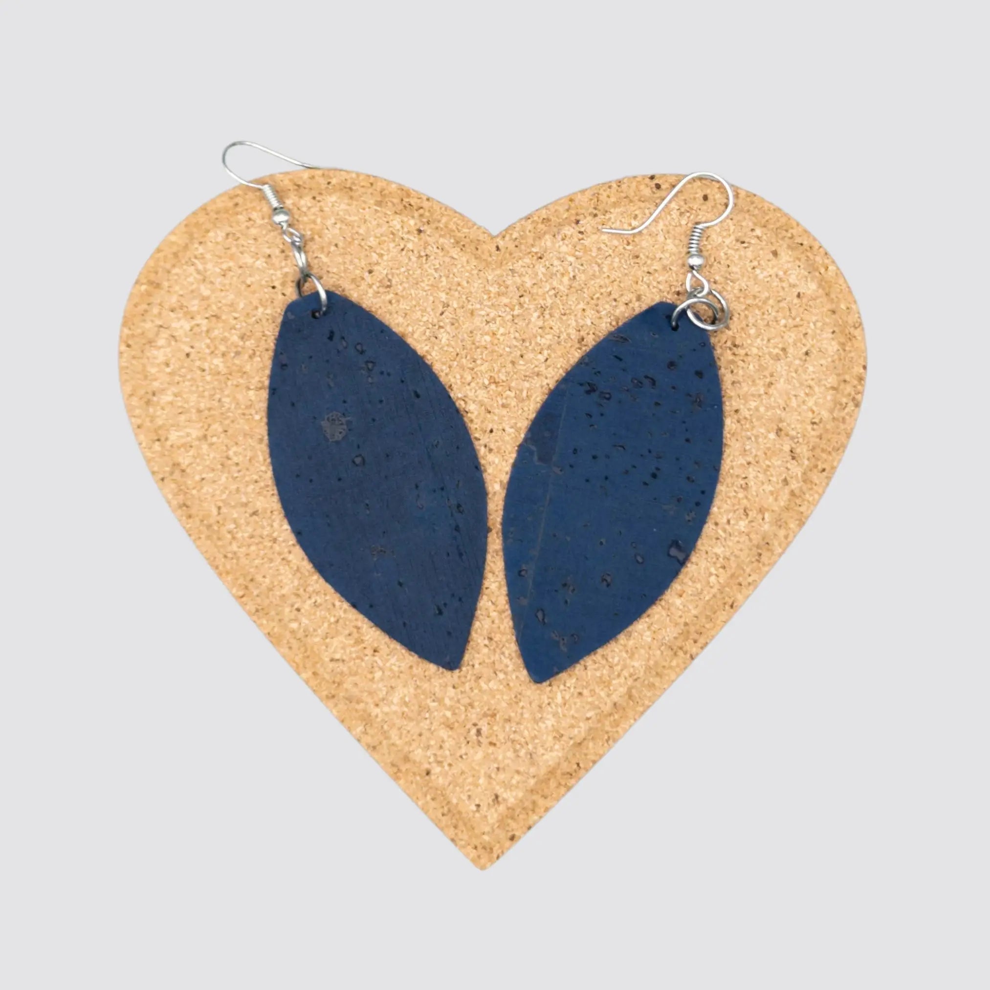 The elegant women earrings made of cork come in a navy blue colour and are displayed on a cork gift box.