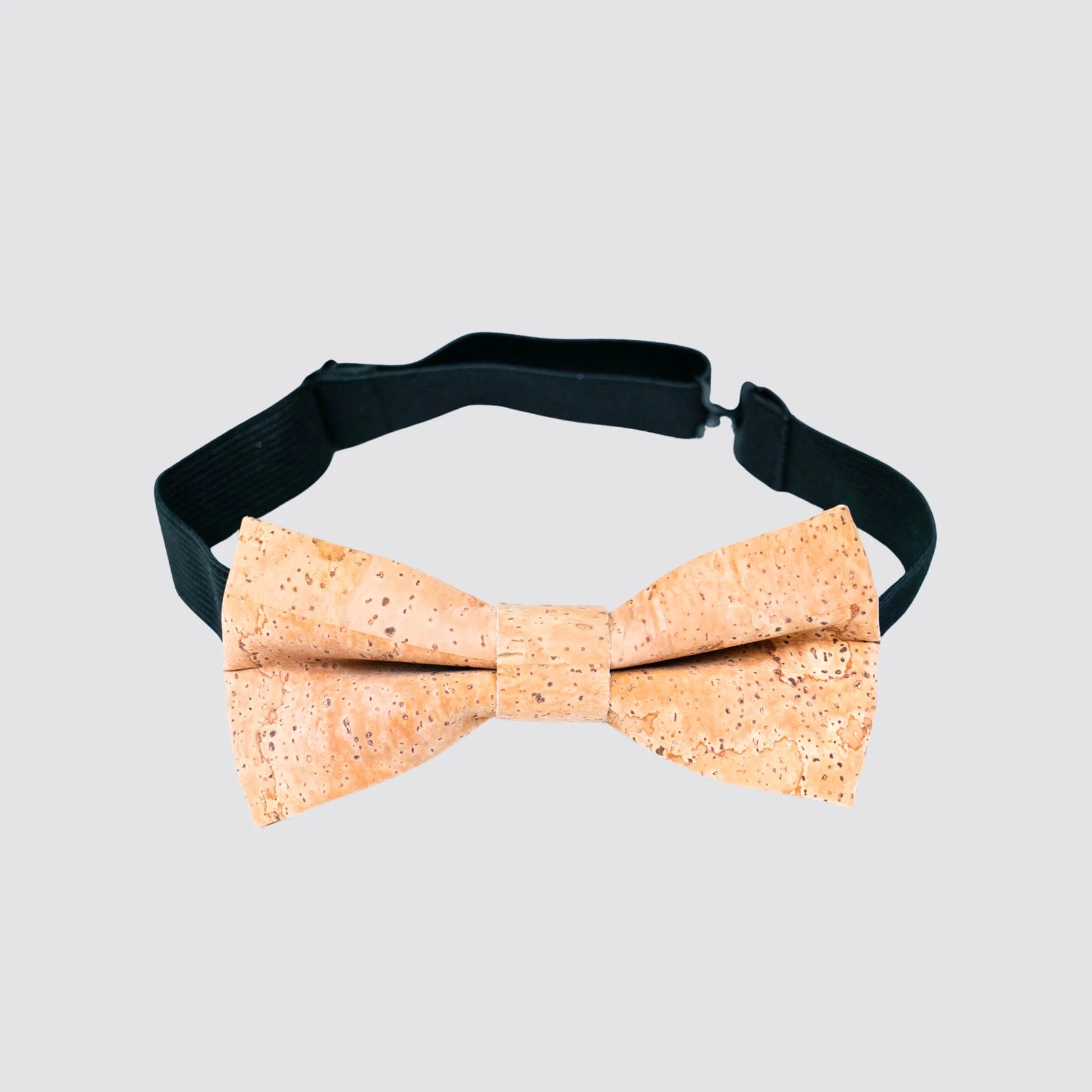 Elegant natural cork bow tie with copper cufflinks for gentlemen.