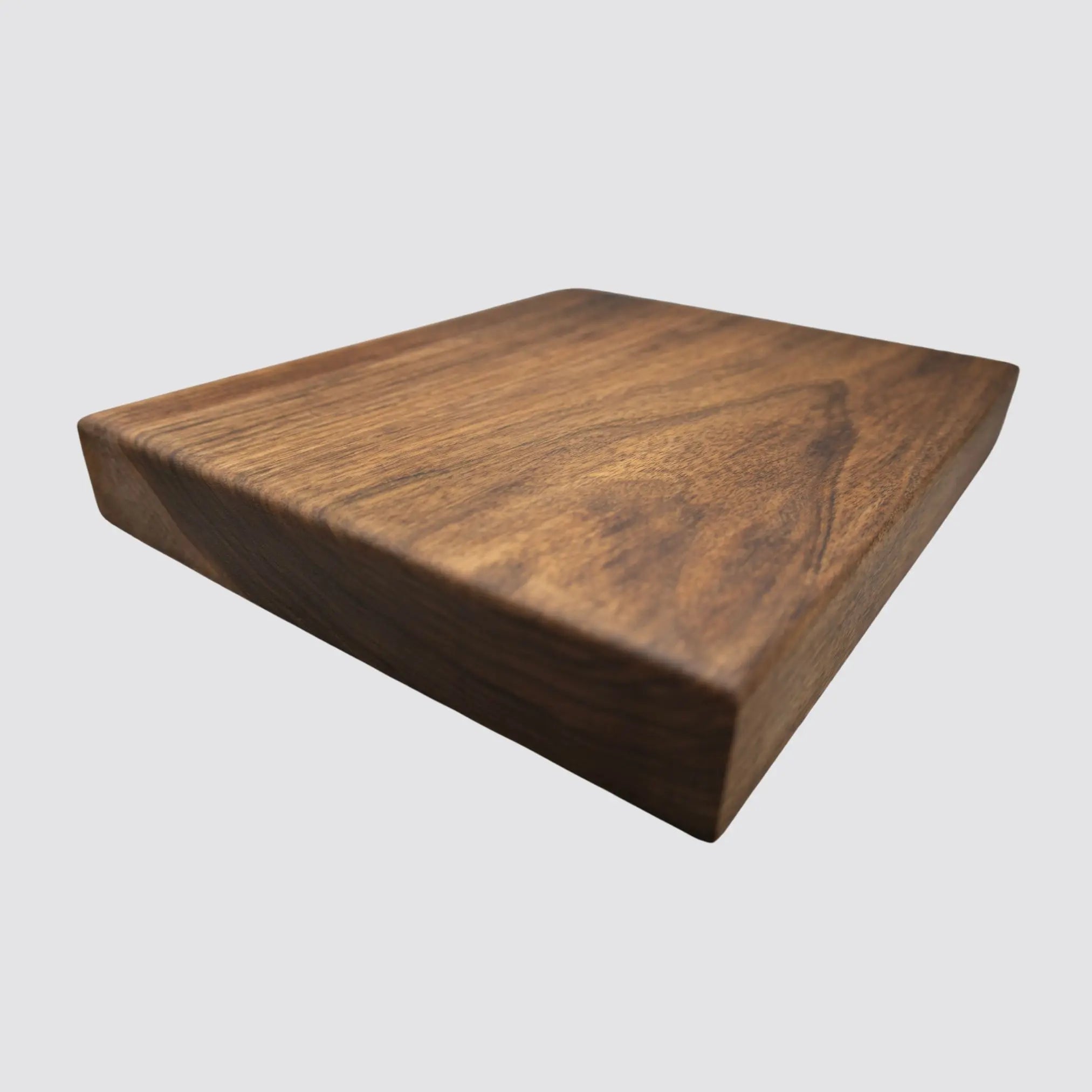 Elegant walnut butcher block suitable for chopping and cutting.