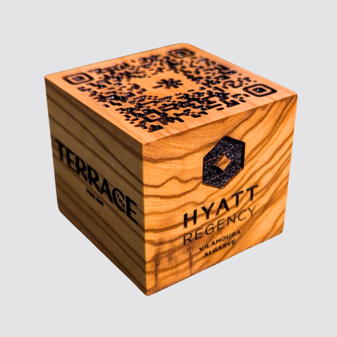 Custom engraved olive wood QR code and logo cube for luxury hospitality