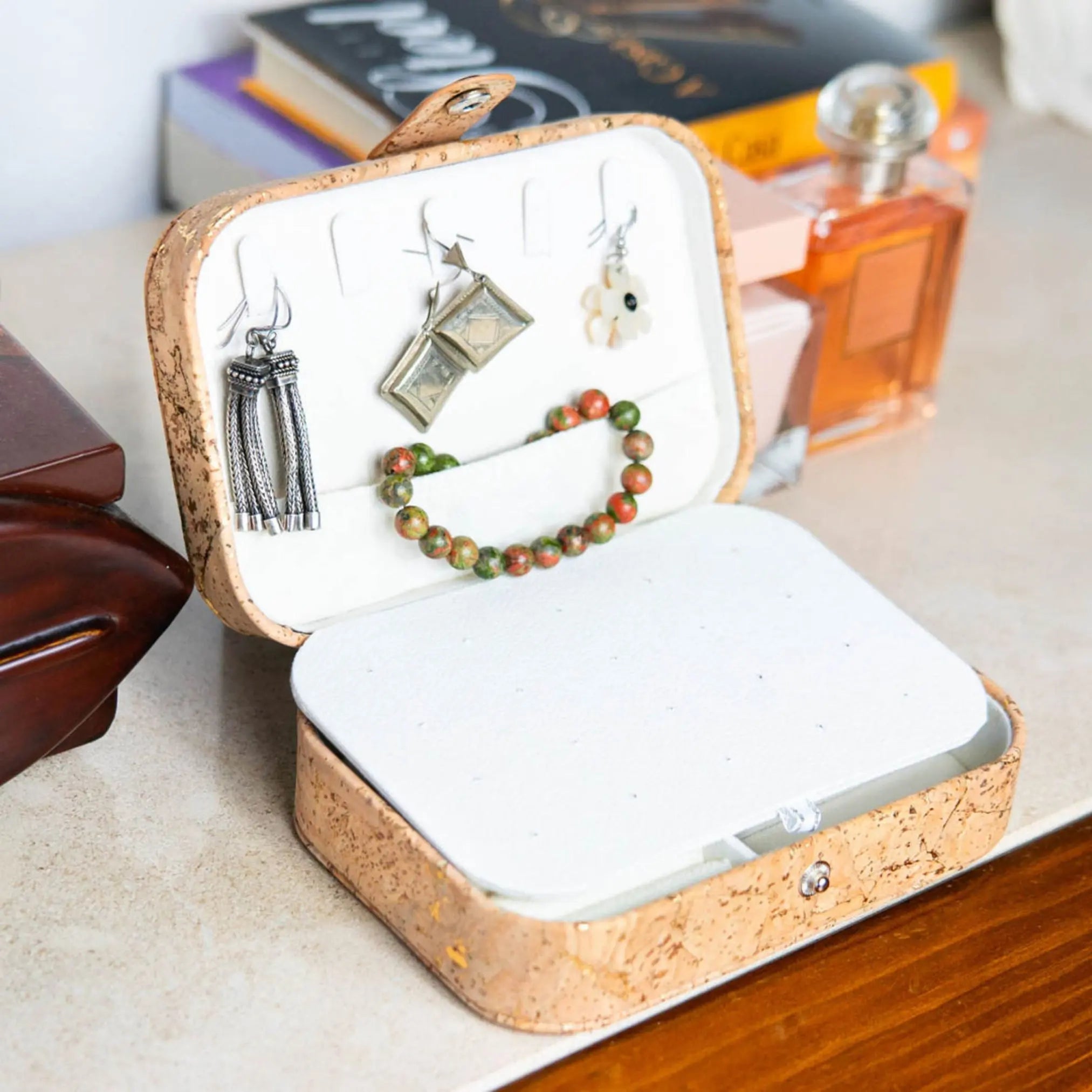 Natural Cork Jewelry Storage Rectangular Box in golden cork style, filled with jewelry on a desk.