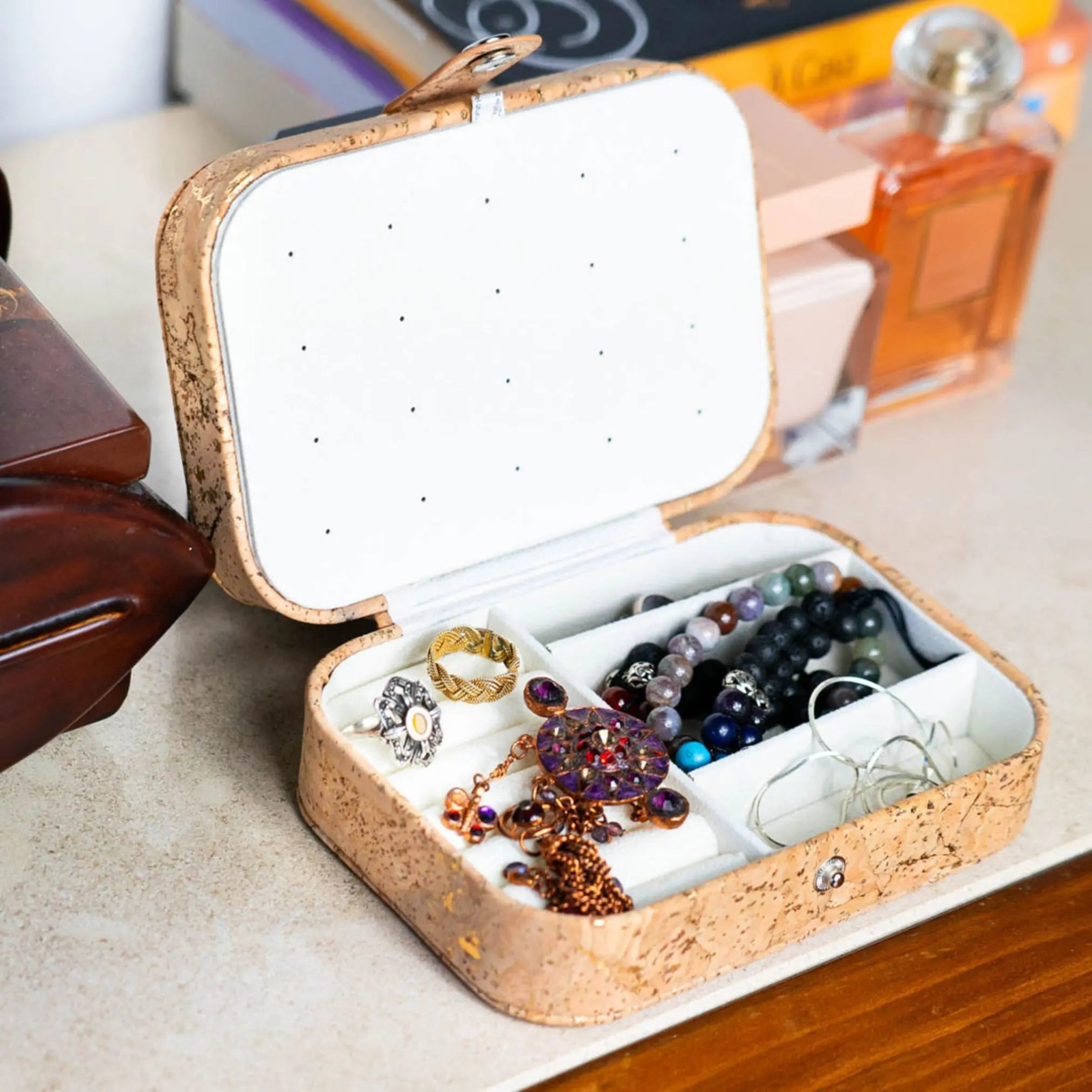 Natural Cork Jewelry Storage Rectangular Box in golden cork style, filled with jewelry.
