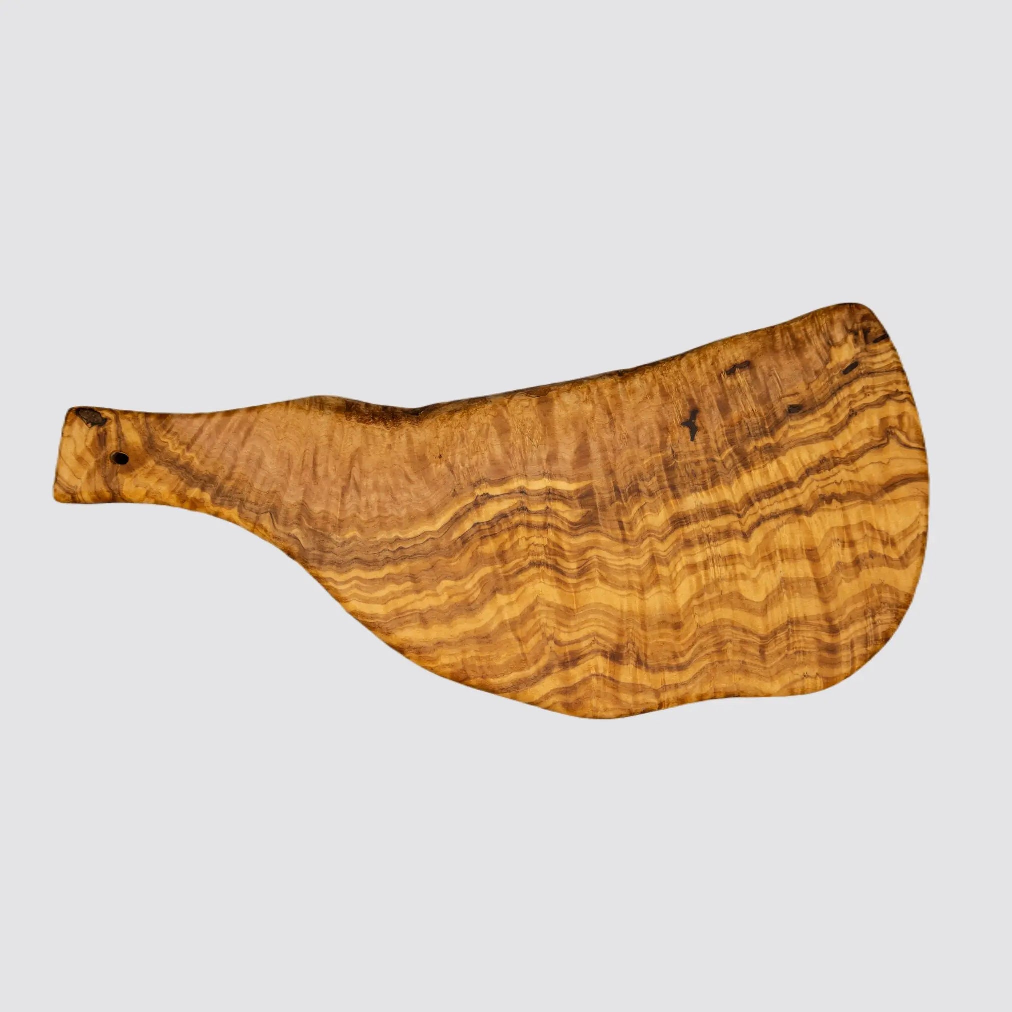 Back view of a handcrafted olive wood serving board, highlighting the unique wood grain patterns on a plain white background.