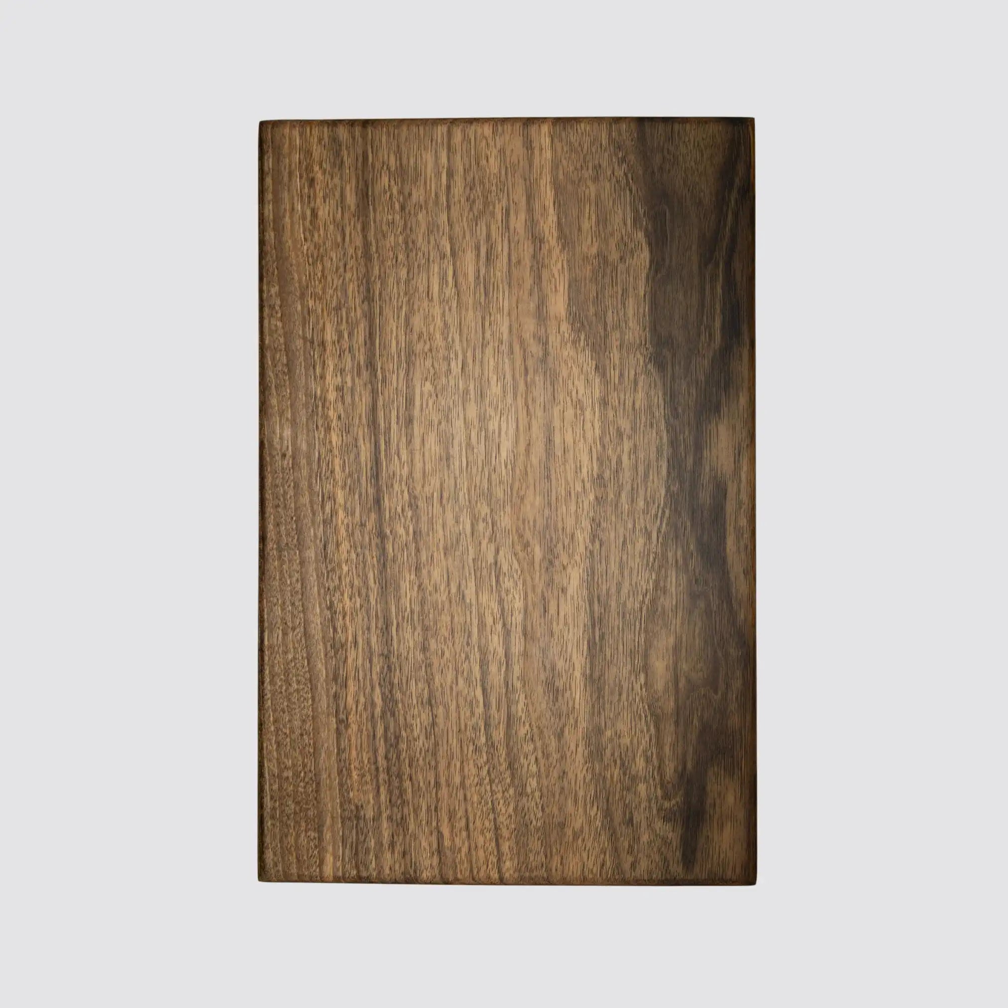 Front view of a handcrafted thick walnut cutting board, showcasing premium quality.