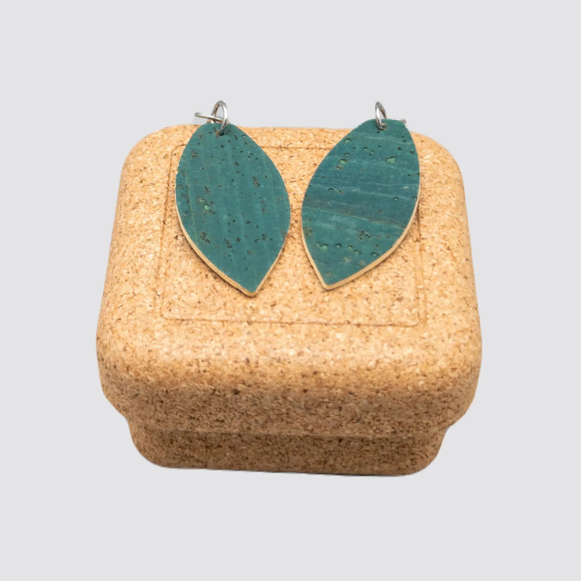 Handmade cork earrings with an elegant leaf design, presented in a square cork gift box.