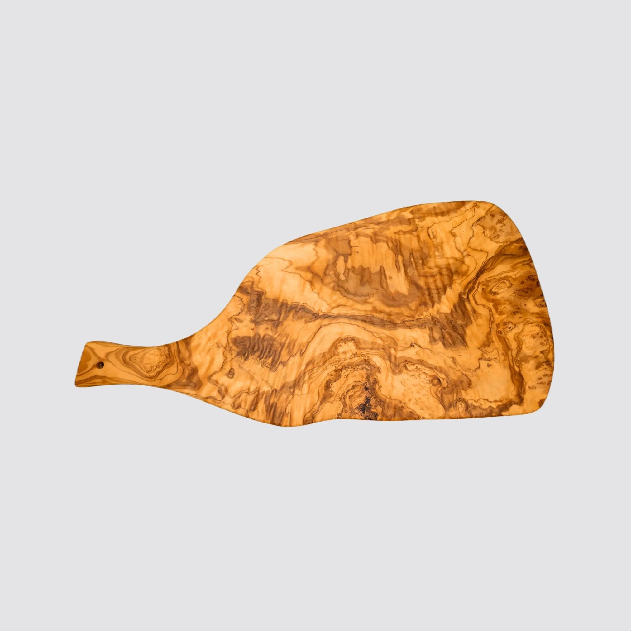 Large olive wood cutting and serving board with handle displaying a smooth finish on a plain background.