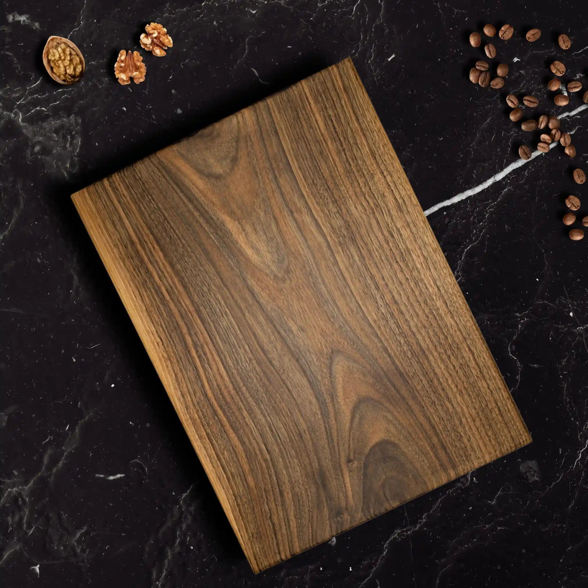 The large walnut chopping and cutting board is displayed on a luxury dinning table.