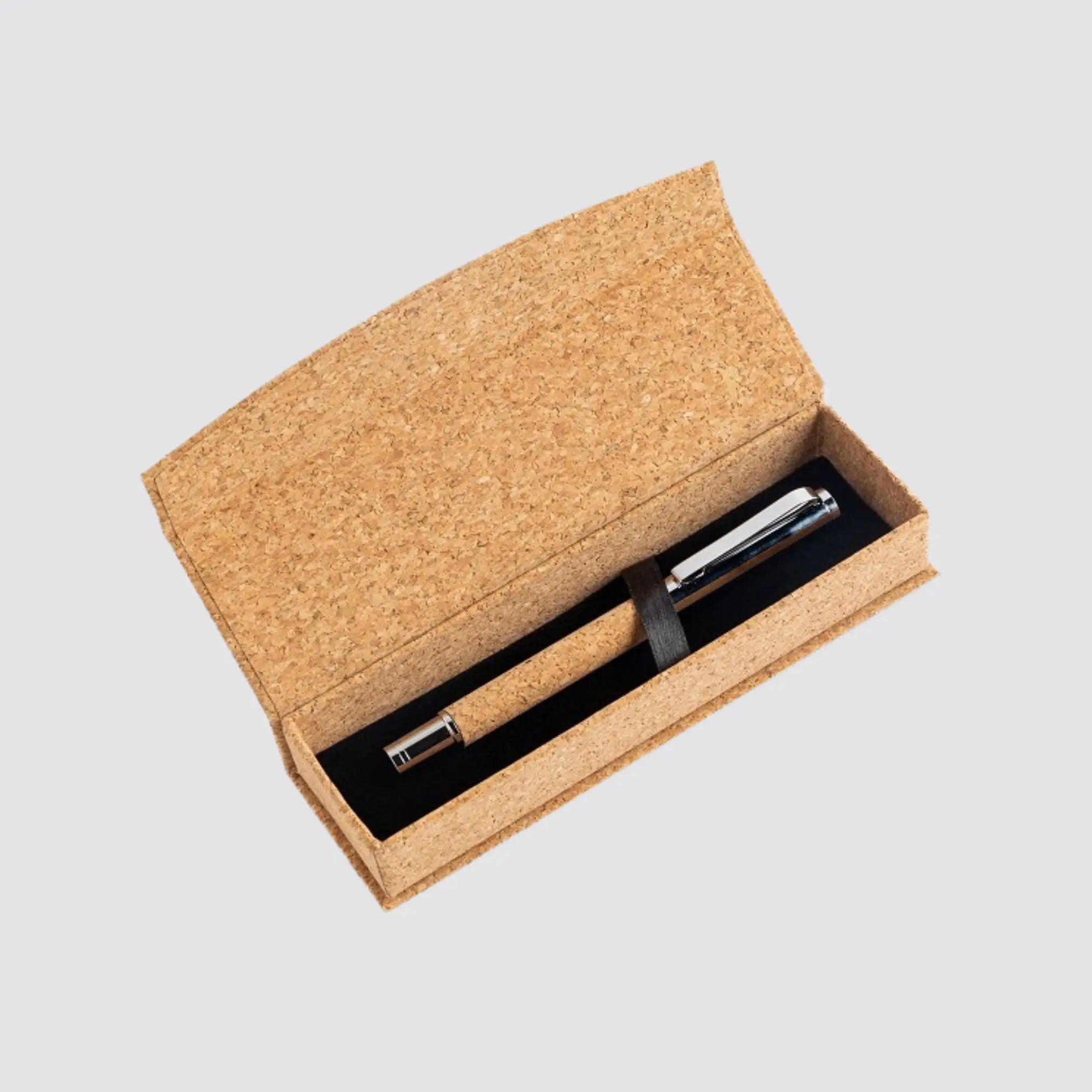 Top view of an opened luxury metal and cork roller pen set, highlighting its refined craftsmanship.
