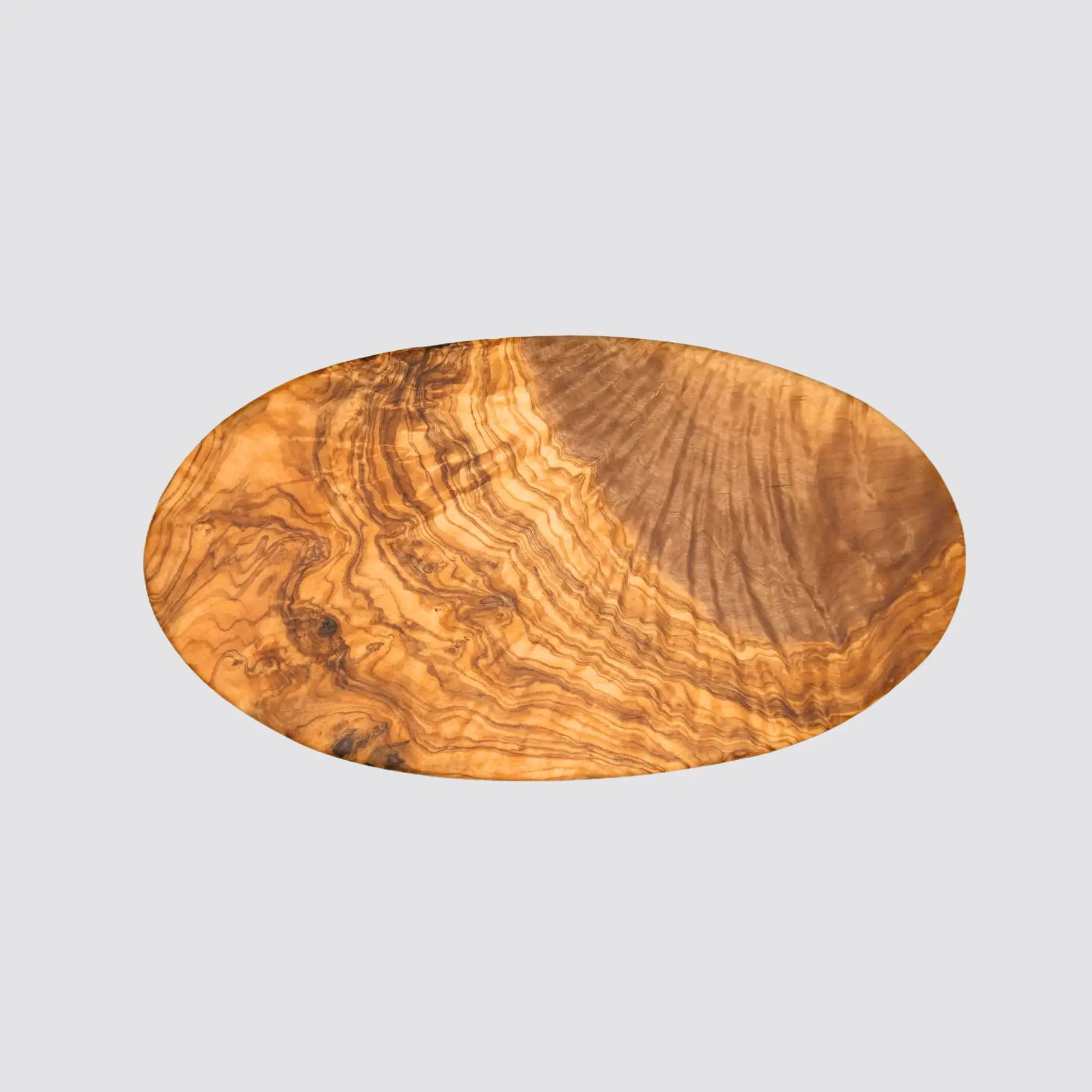 Front view of a luxurious oval olive wood serving board showcasing its smooth finish and unique grain patterns.