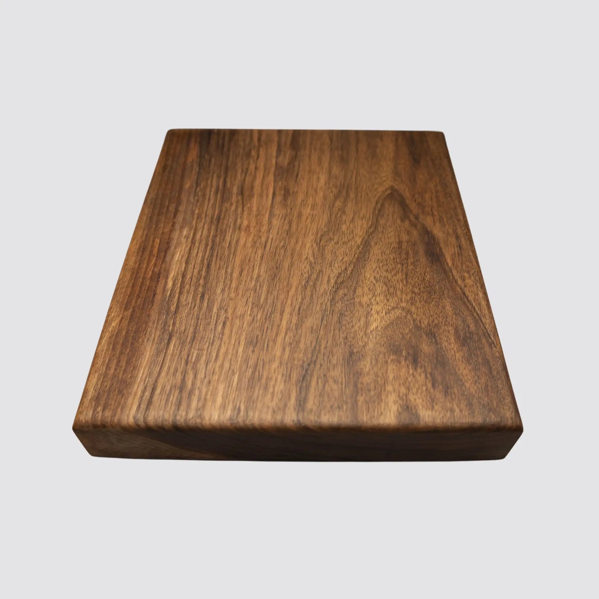 Luxurious walnut chopping and cutting block made from sustainably sourced wood.