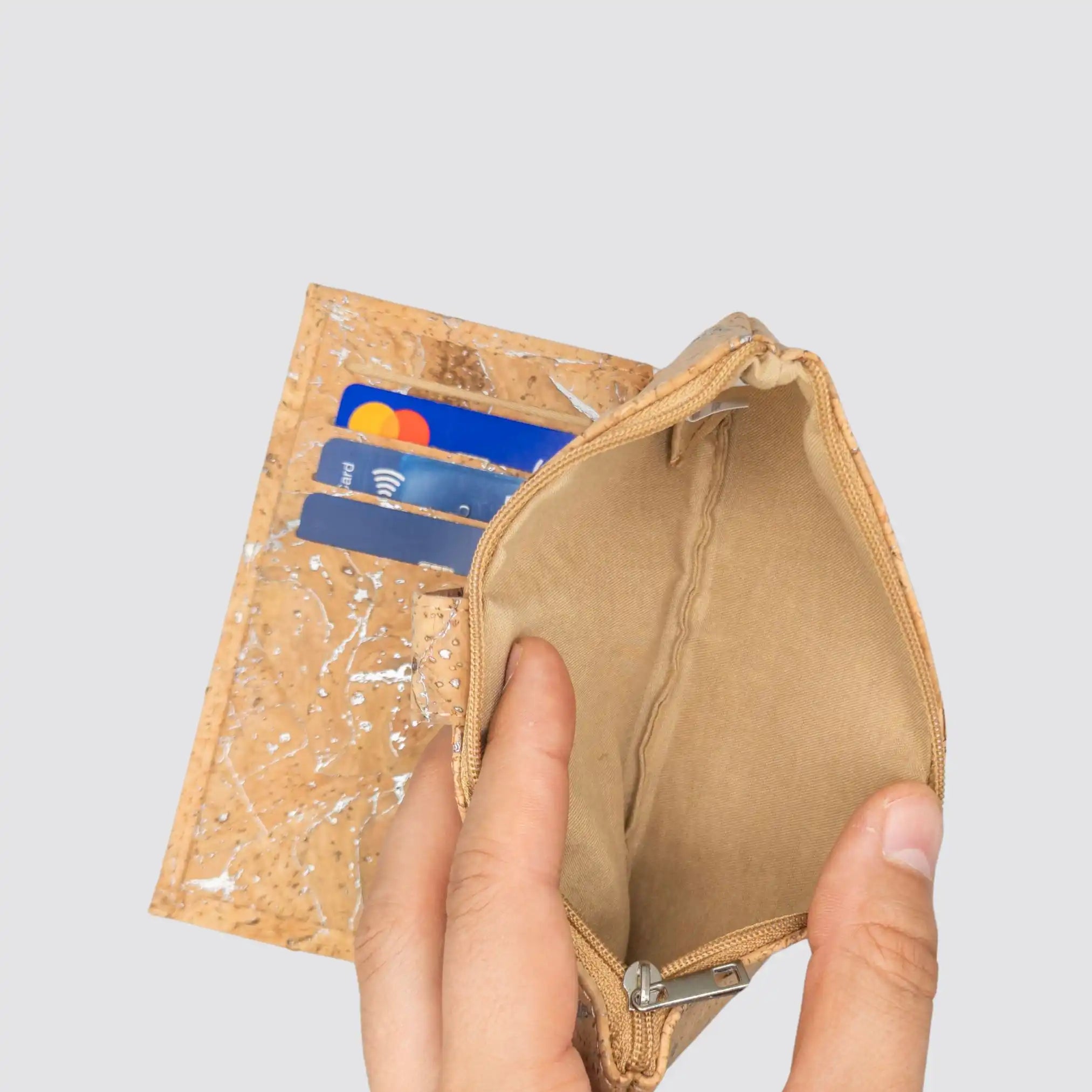 Minimalist silver cork wallet for women with 3 card slots and a bill pocket.
