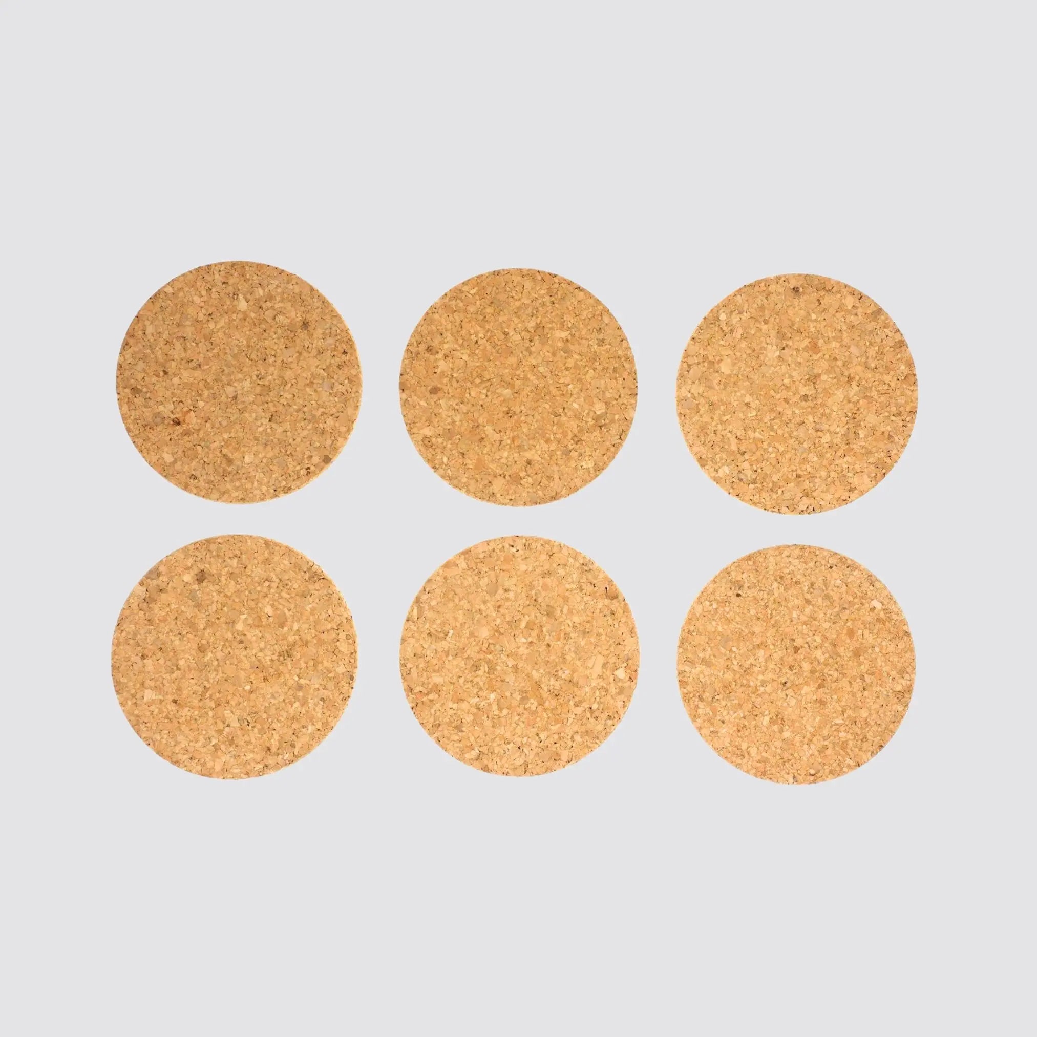 Natural cork coaster set in a round shape.