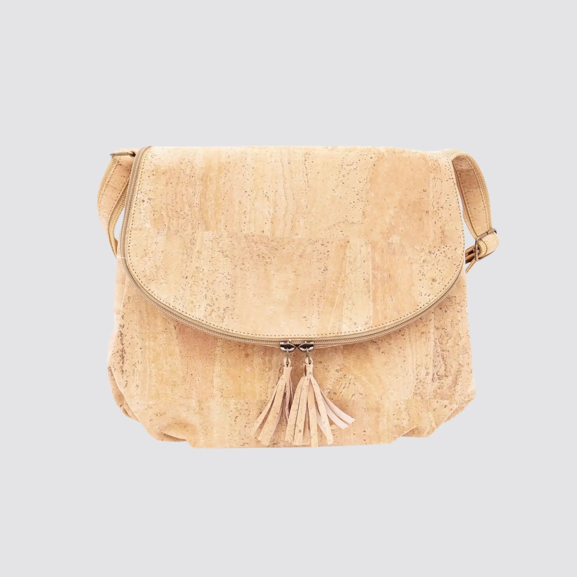 Natural cork crossbody bag featuring a classic tassel accent for added style.