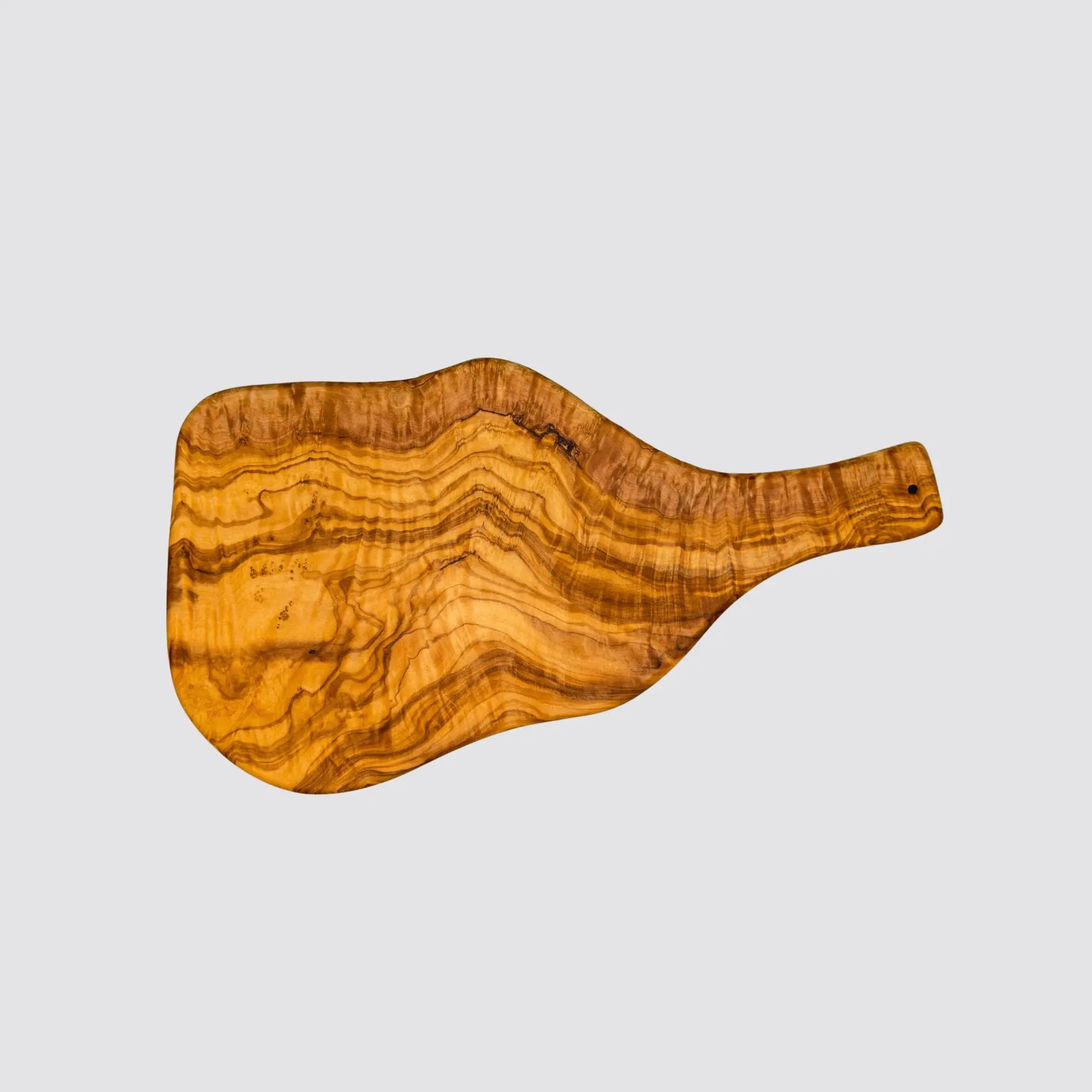 The olive cutting board with its rustic natural grain and luxurious style displayed on a plain background.