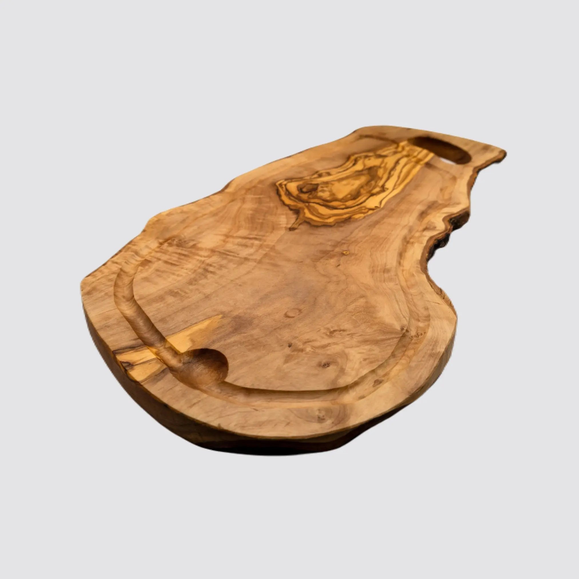 Eco-friendly olive wood cutting board showcasing unique grain patterns.
