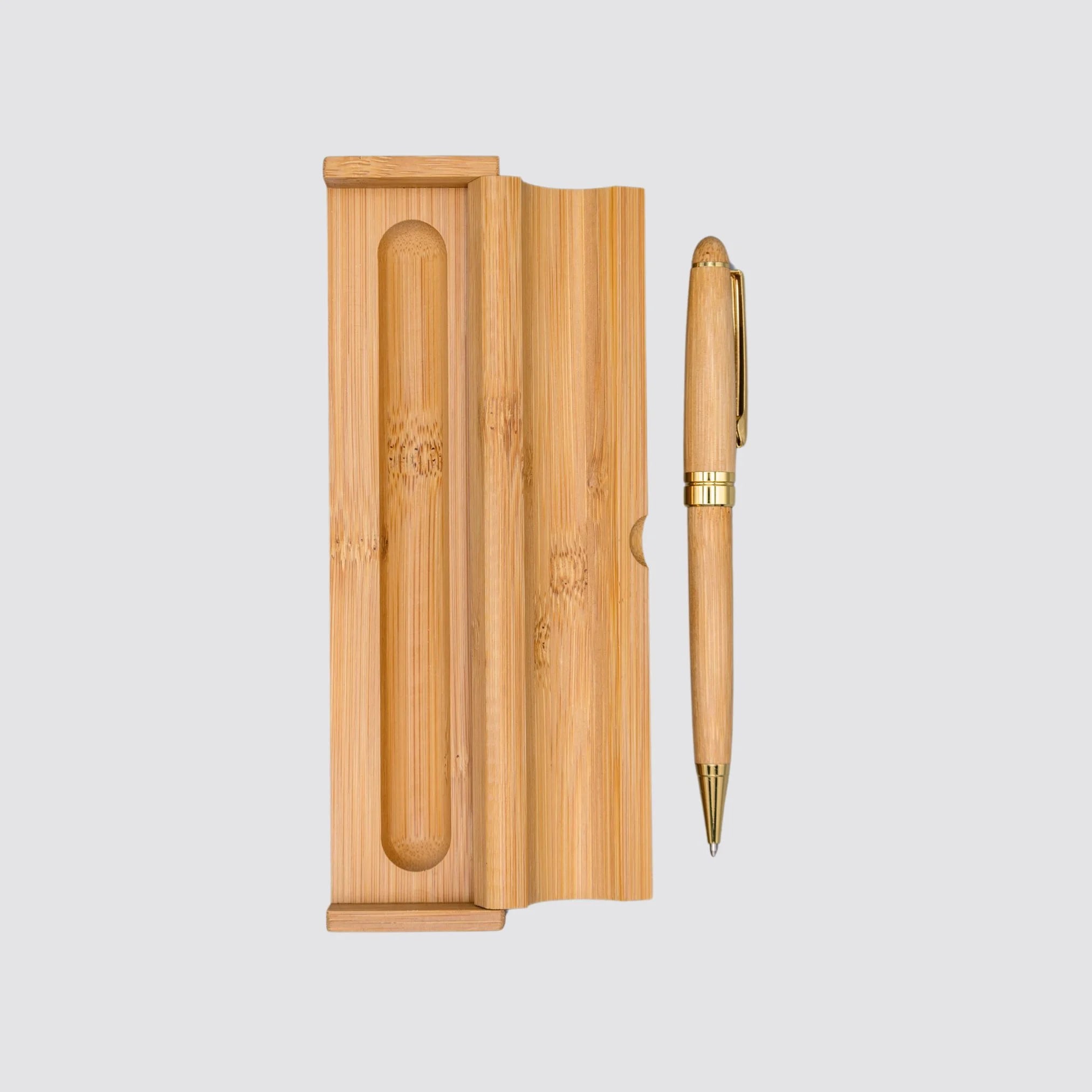 Open bamboo gift box next to a luxury bamboo ballpoint pen, perfect for sustainable and sophisticated gifting.