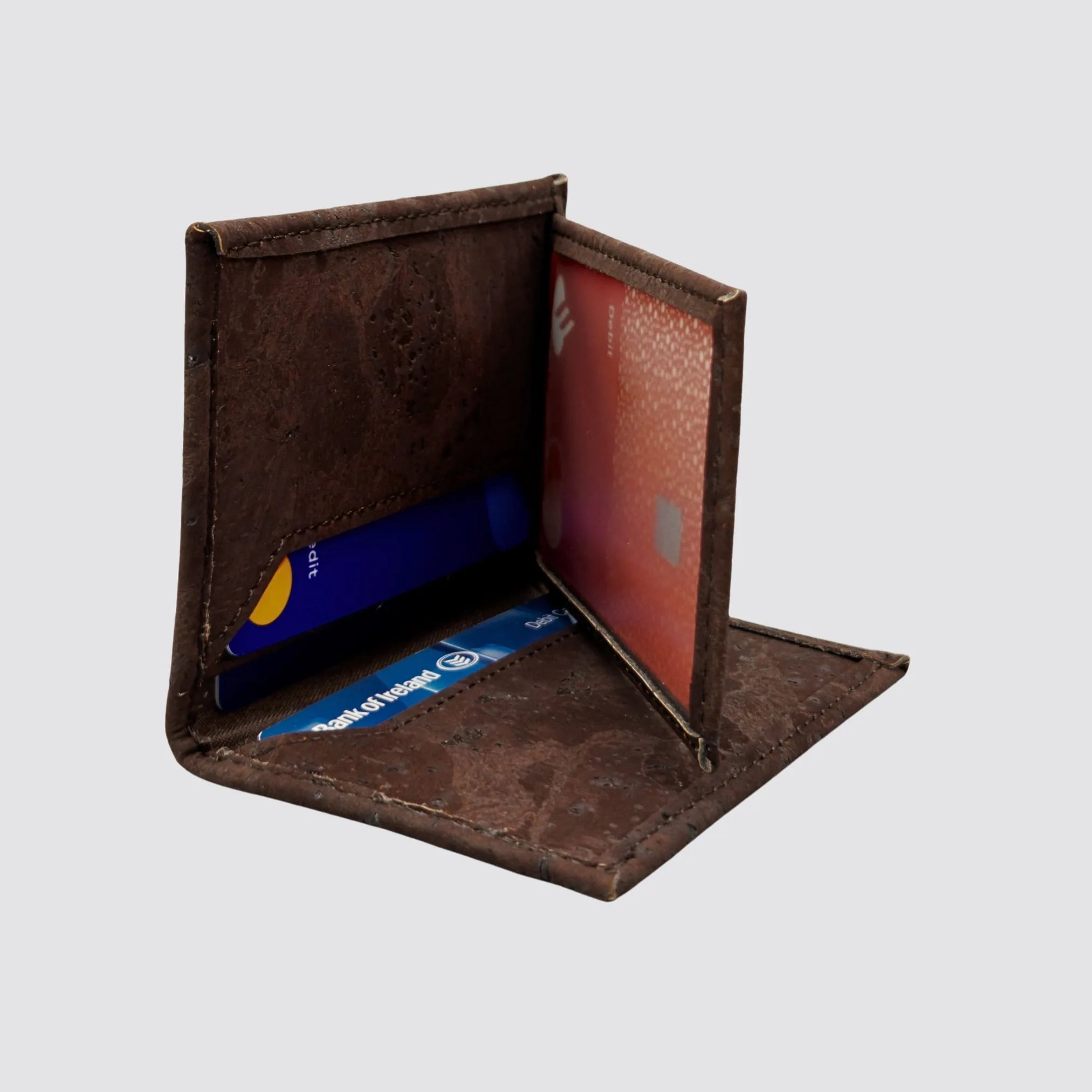 Open view of the cork cardholder displaying 4 card slots and an ID pocket for streamlined organization.