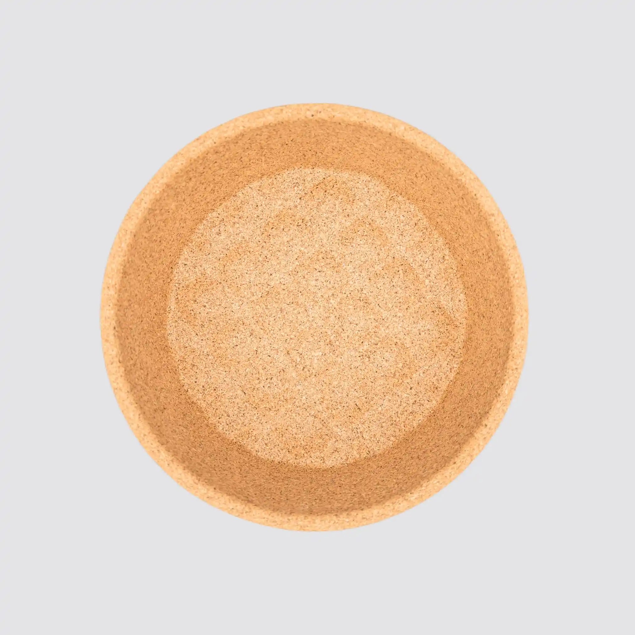 Round cork snack bowl with eco-friendly design and rustic charm.