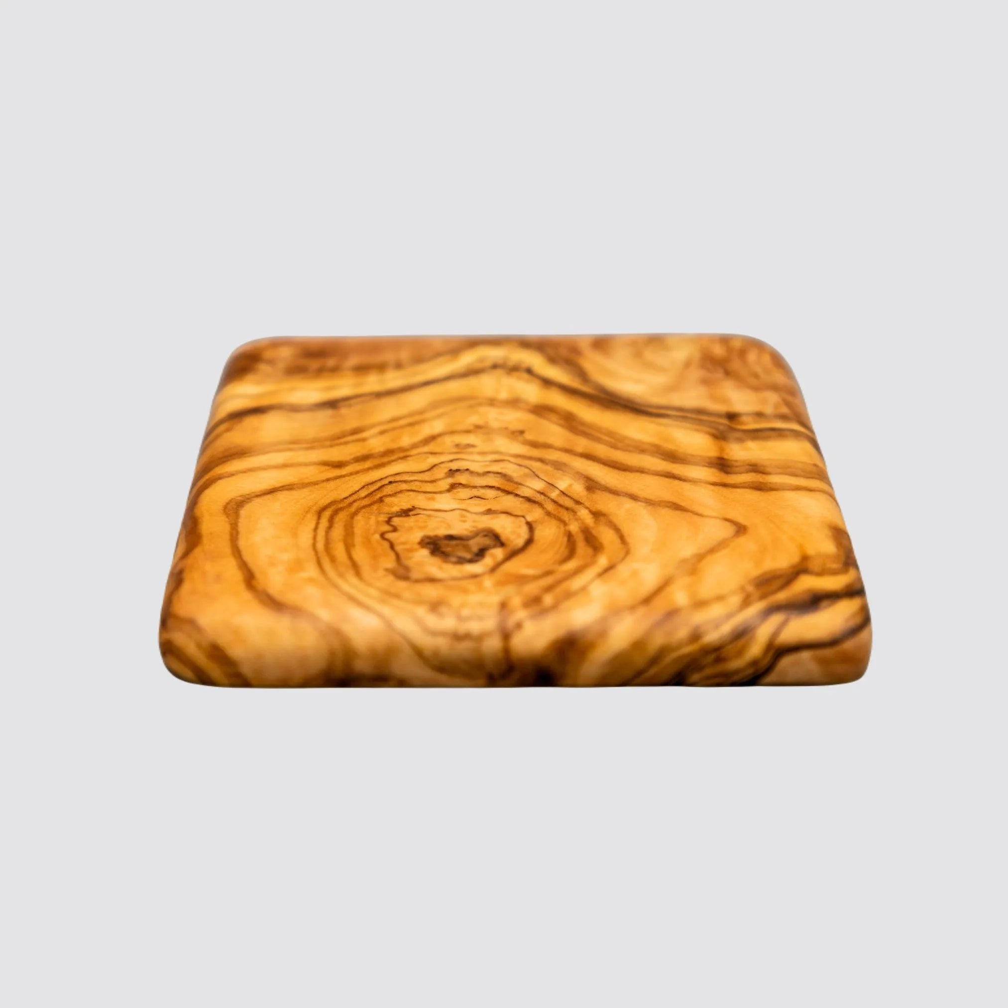 Stylish olive wood coaster with rustic charm and smooth finish.
