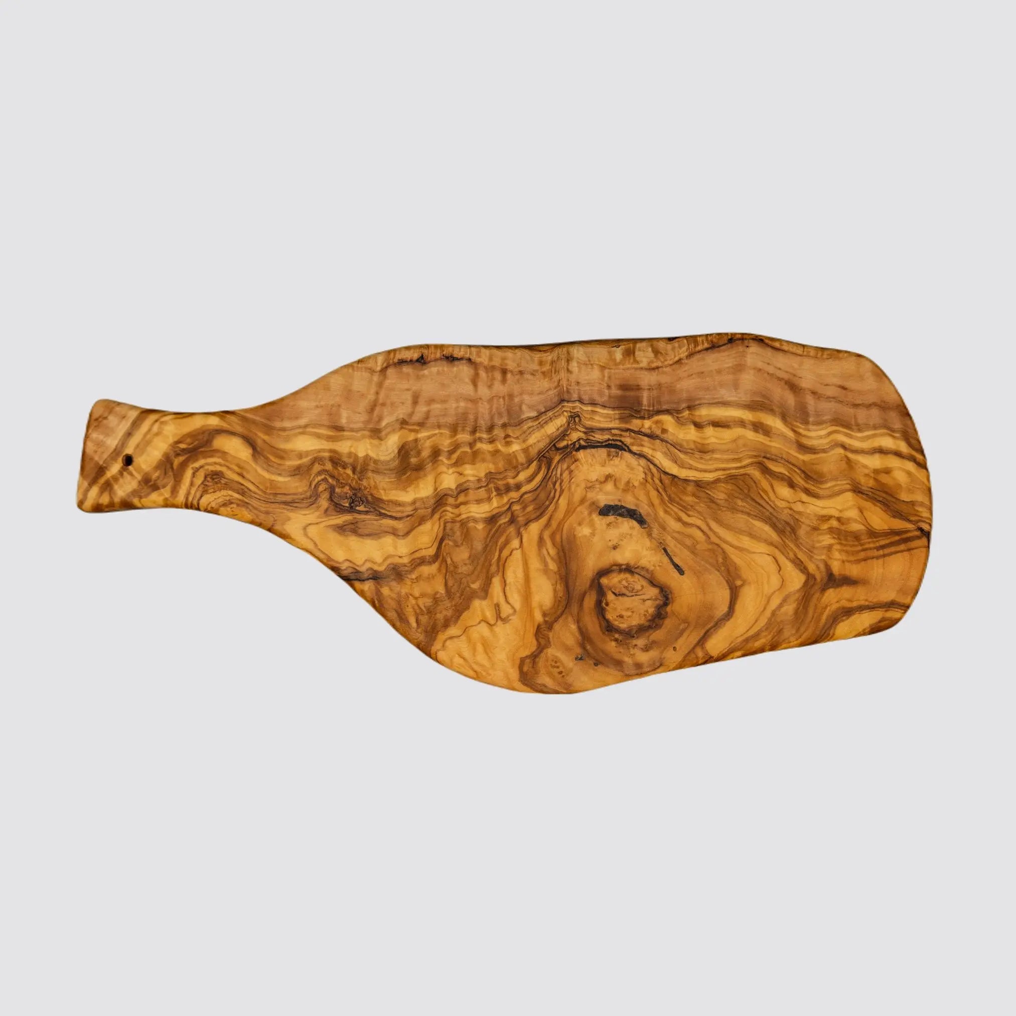 Overhead view of a rustic olive wood serving board, highlighting its smooth surface and intricate wood grain on a plain white background.