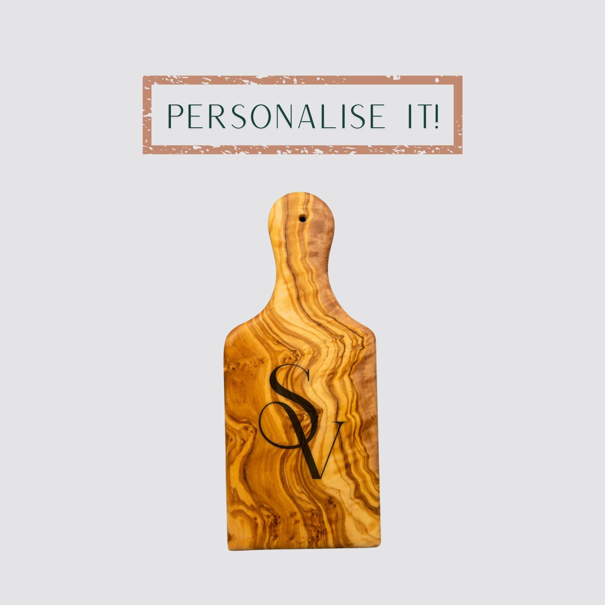 The small serving and cutting board is made of premium olive wood and is personalised.