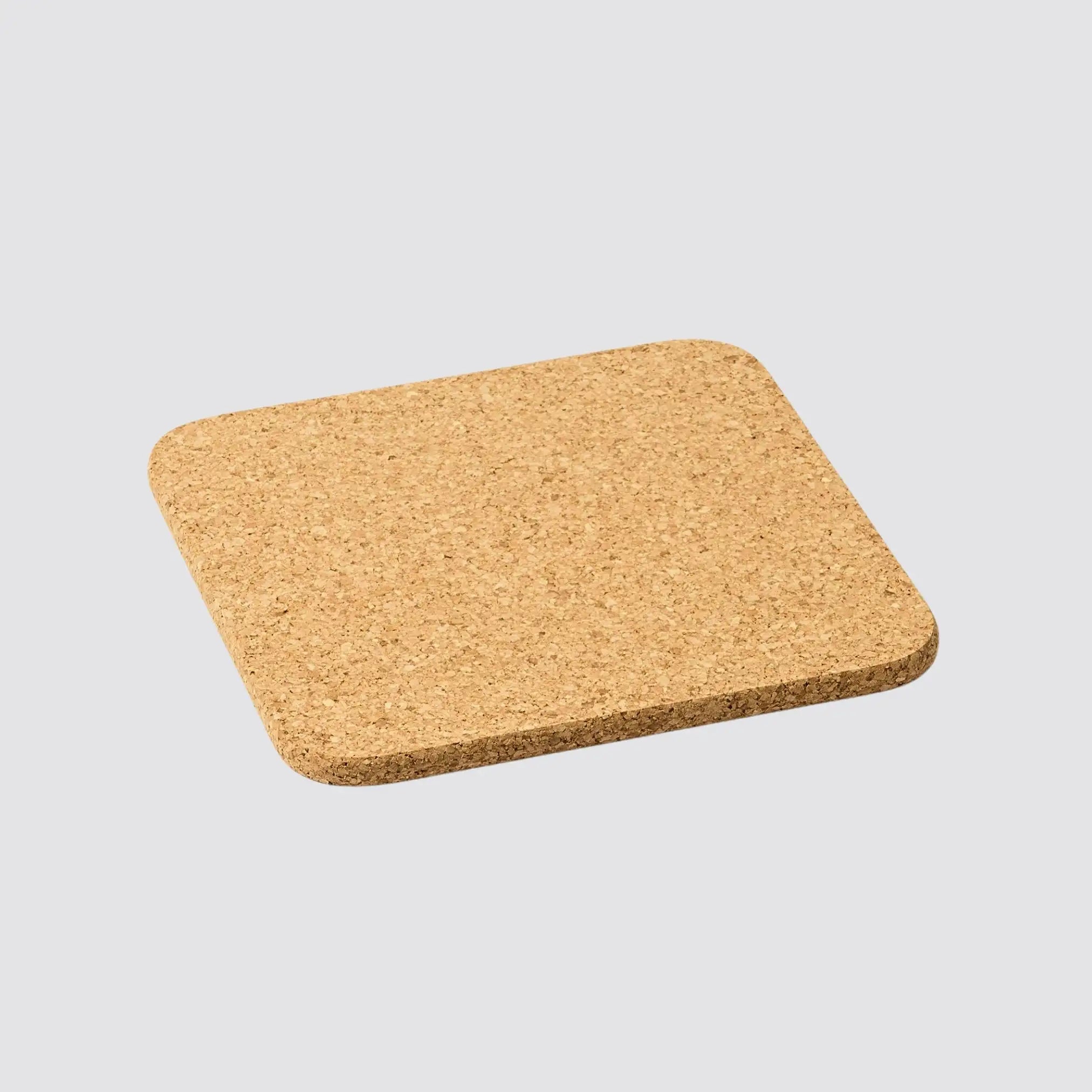 Square cork placemat offering eco-friendly protection for dining tables.