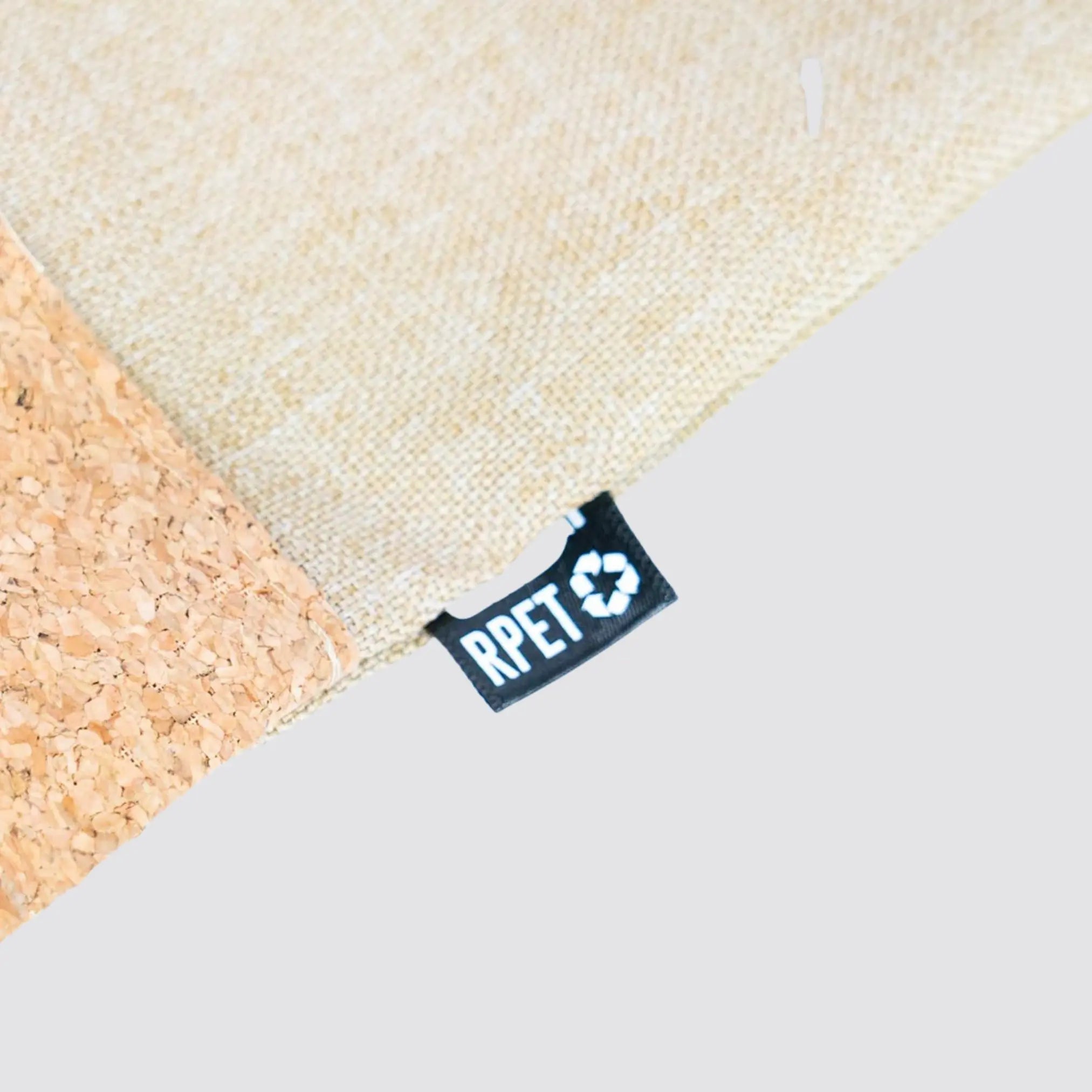 Close-up of the stylish drawstring bag, emphasizing the texture of cotton and cork materials.