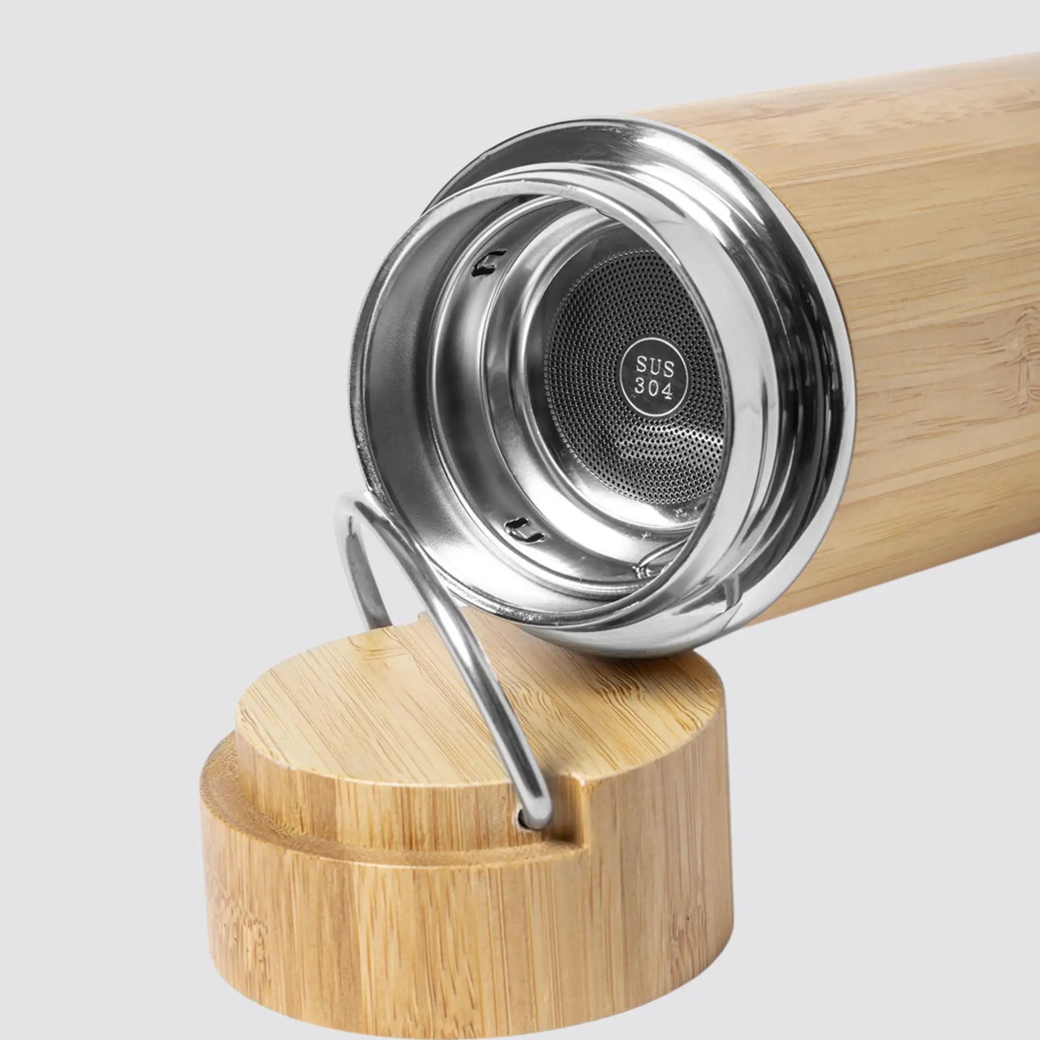 Sustainable bamboo and stainless steel thermos for hot and cold beverages.
